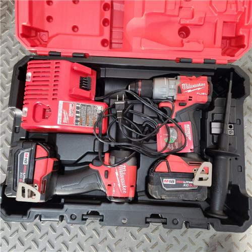 Houston location- AS-IS Milwaukee 3697-22 M18 FUEL 1/2 Hammer Driller/Driver &1/4 Hex Impact Driver Appears in new condition 2 Tool Combo Kit