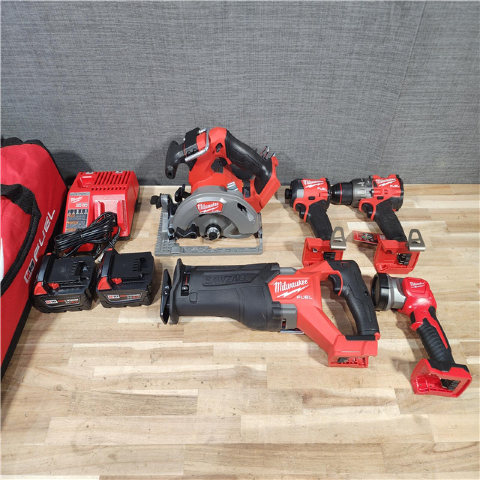 HOUSTON LOCATION - AS-IS M18 FUEL 18V Lithium-Ion Brushless Cordless Combo Kit (5-Tool) with Two 5.0 Ah Batteries  1 Charger 1 Tool Bag
