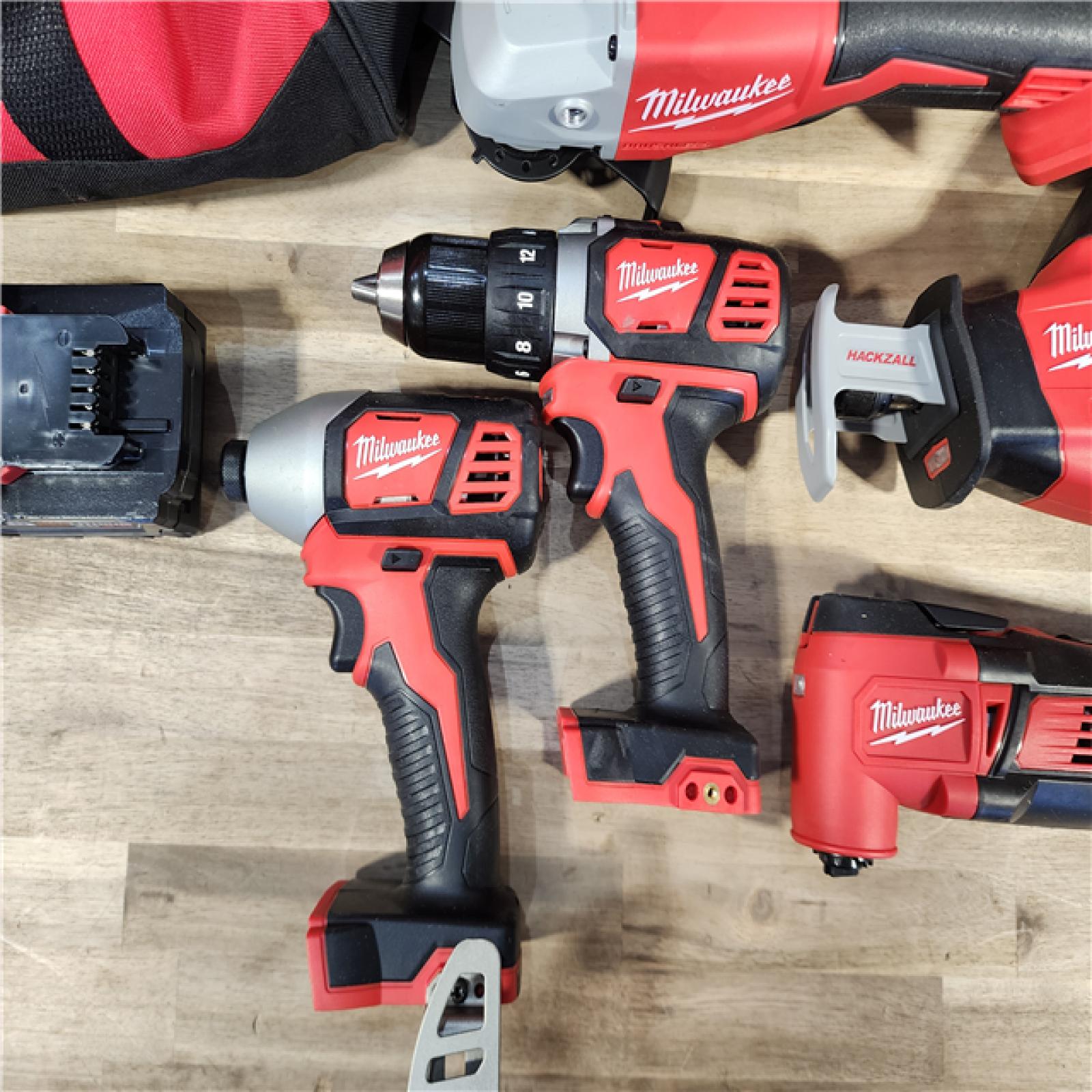 HOUSTON LOCATION - AS-IS Milwaukee M18 18-Volt Lithium-Ion Cordless Combo Kit 7-Tool with 2-Batteries, Charger and Tool Bag