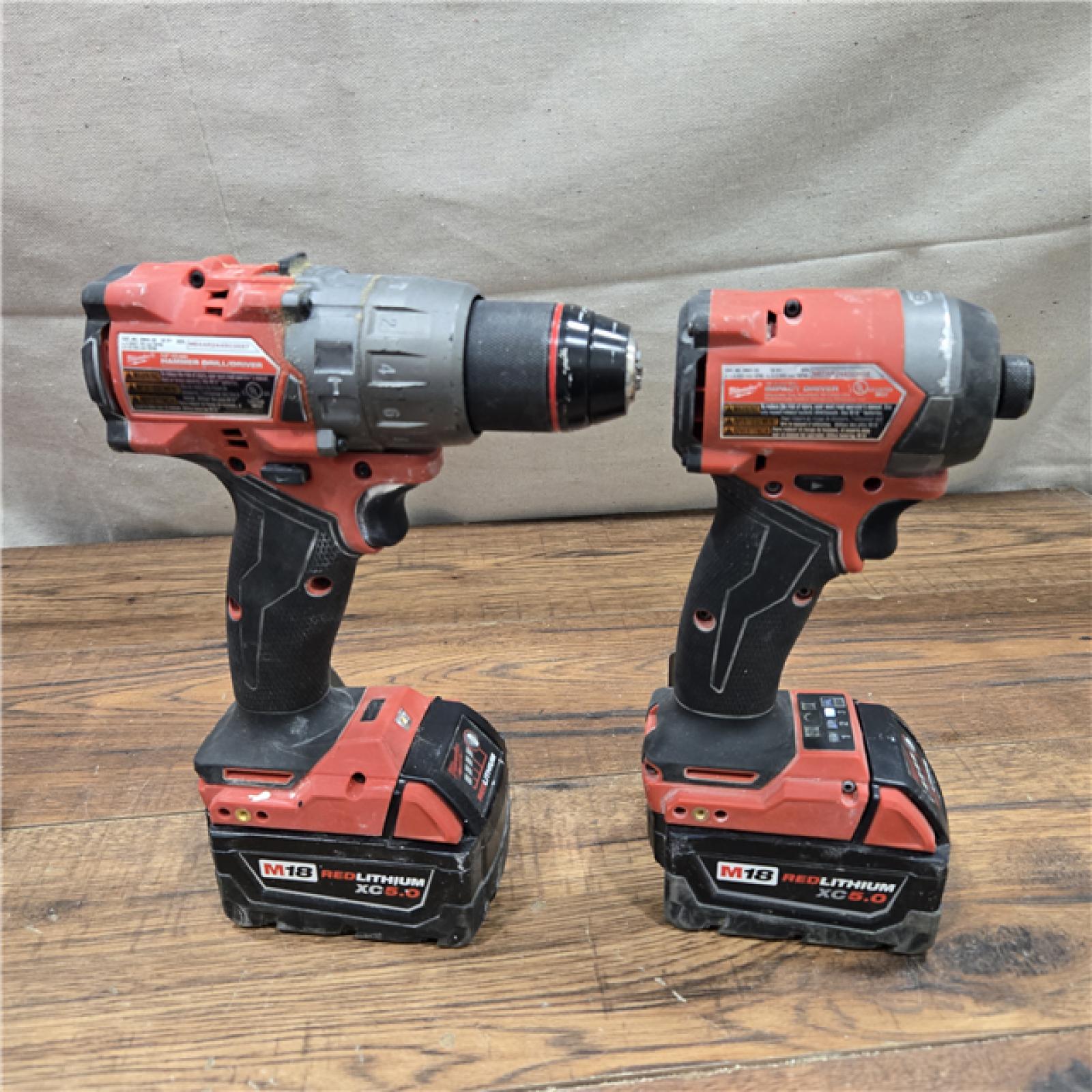 AS-IS MILWAUKEE M18 FUEL 18V Lithium-Ion Brushless Cordless Hammer Drill and Impact Driver Combo Kit (2-Tool) with 2 Batteries