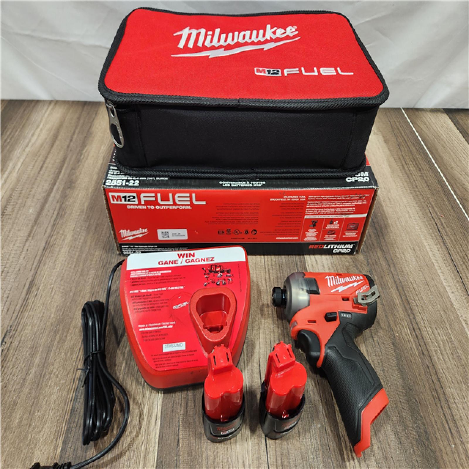 AS-IS Milwaukee M12 FUEL SURGE 12V Lithium-Ion Brushless Cordless 1/4 in. Hex Impact Driver Compact Kit W/Two 2.0Ah Batteries, Bag