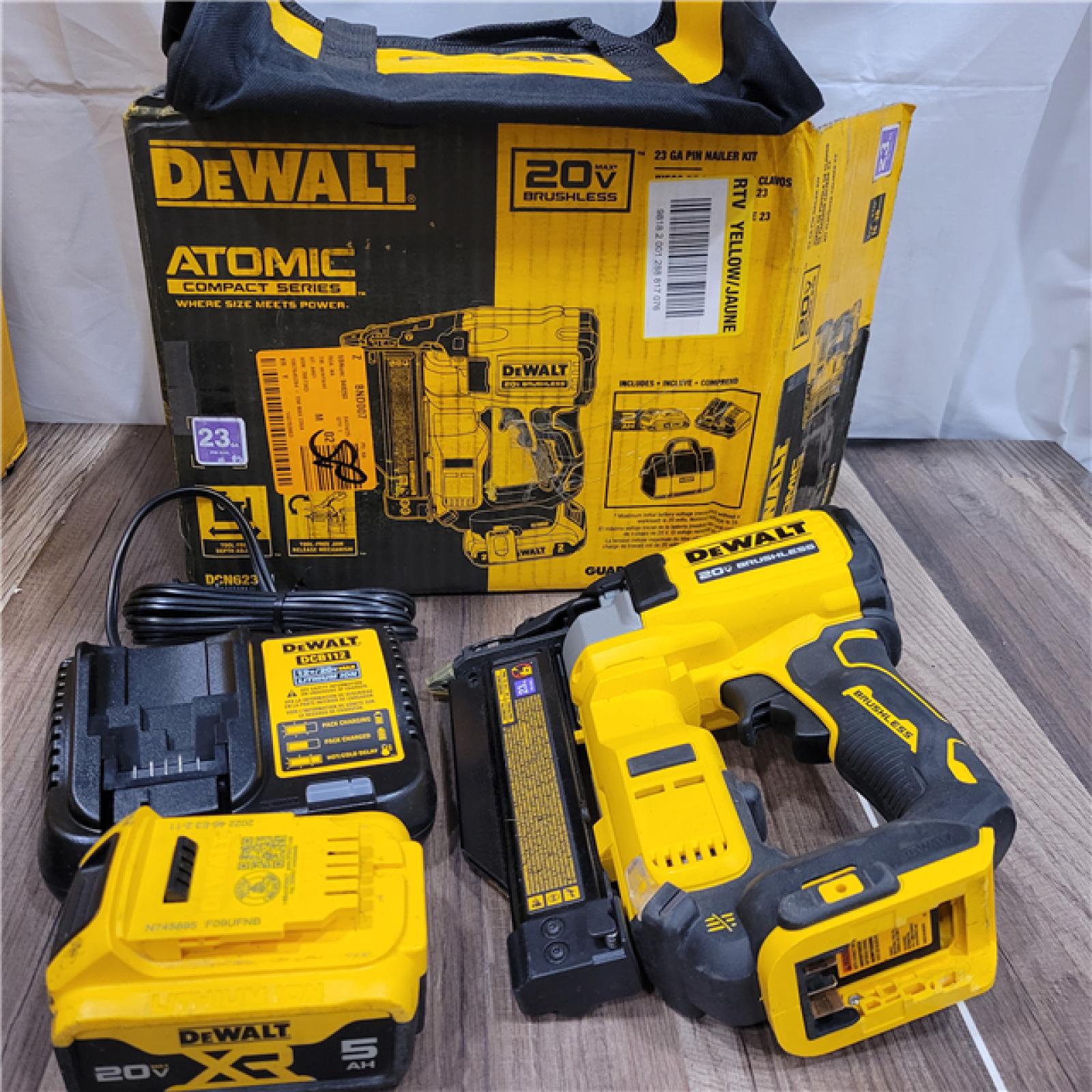 AS-IS DEWALT ATOMIC 20V MAX Lithium Ion Cordless 23 Gauge Pin Nailer Kit with 3.0Ah Battery and Charger
