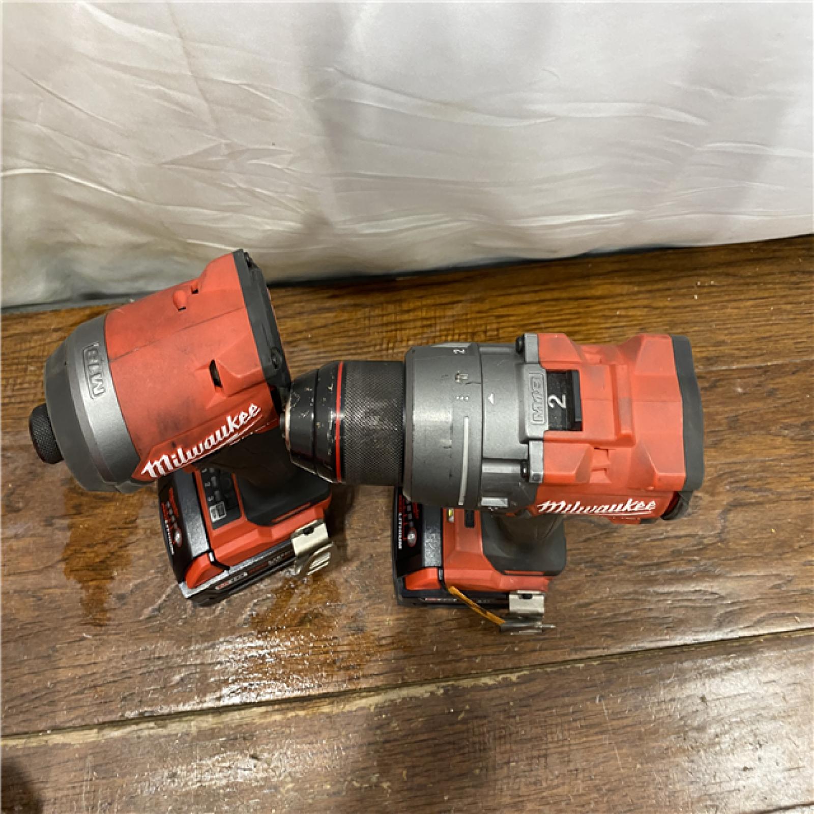 AS-IS MILWAUKEE M18 FUEL 18V Lithium-Ion Brushless Cordless Hammer Drill and Impact Driver Combo Kit (2-Tool) with 2 Batteries
