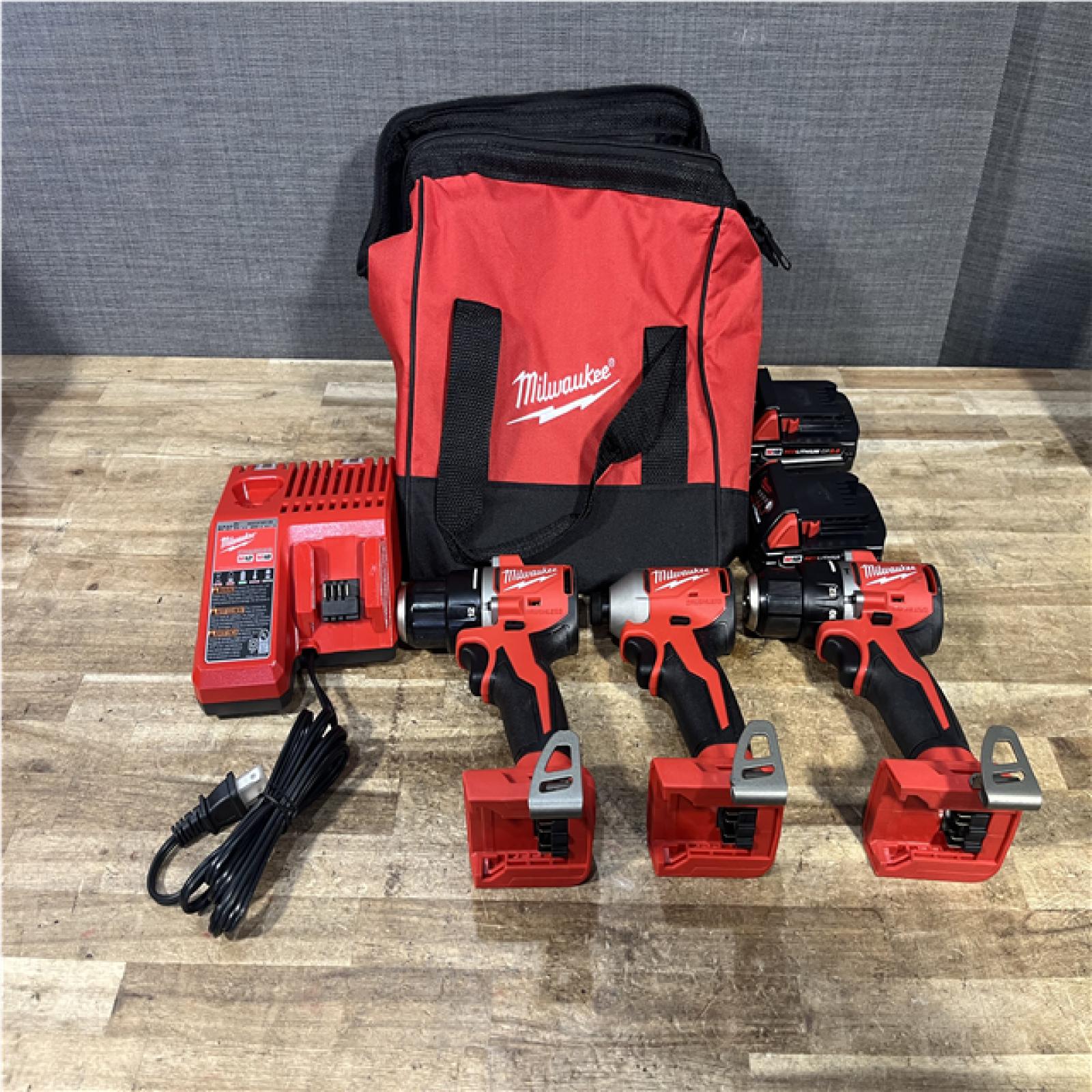 Houston Location AS-IS Milwaukee Hammer Drill Driver and Drill Driver and impact Driver and Batteries QTY/2 with Charger