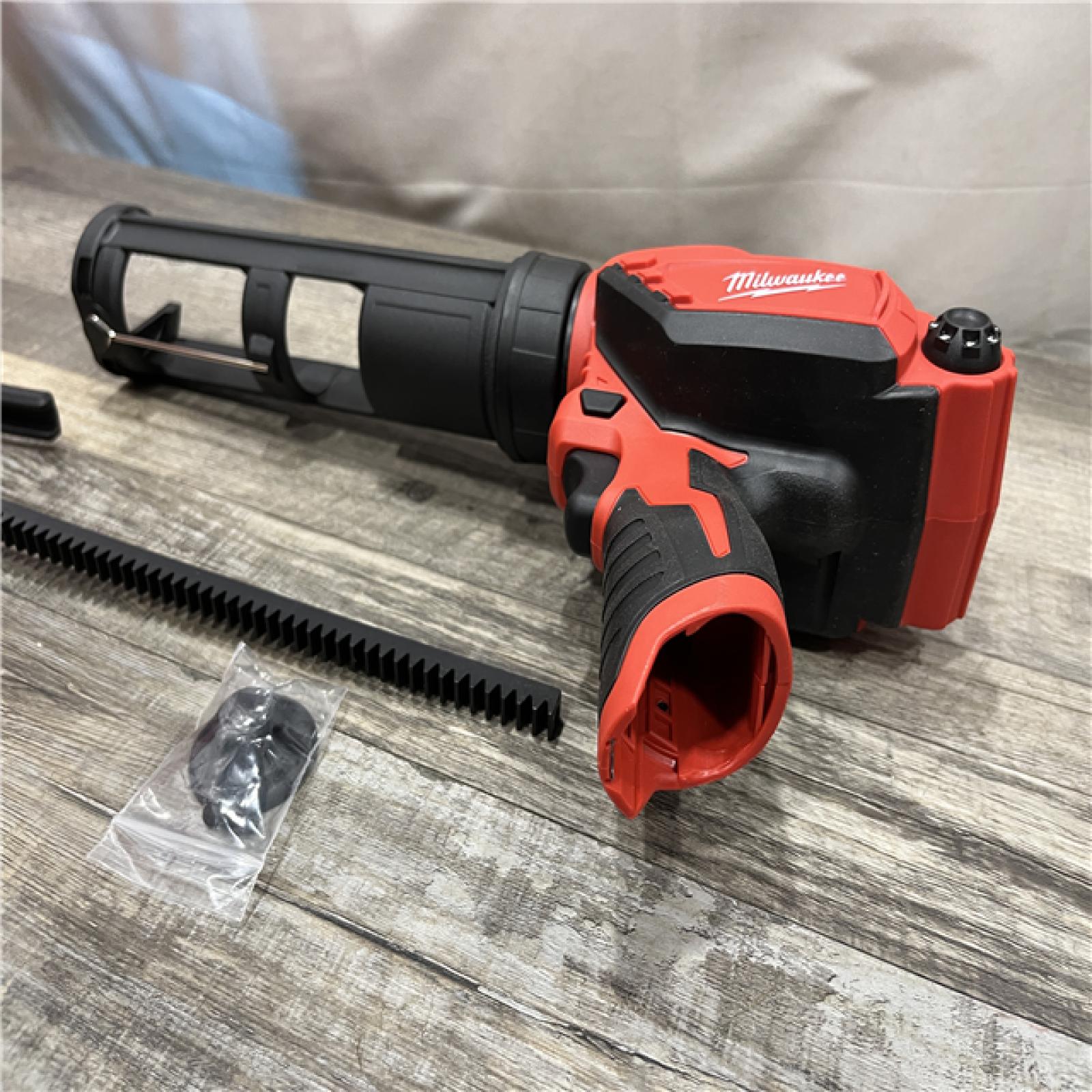 AS-IS Milwaukee 12V Lithium-Ion Cordless 10 oz. Adhesive and Caulk Gun (Tool-Only)