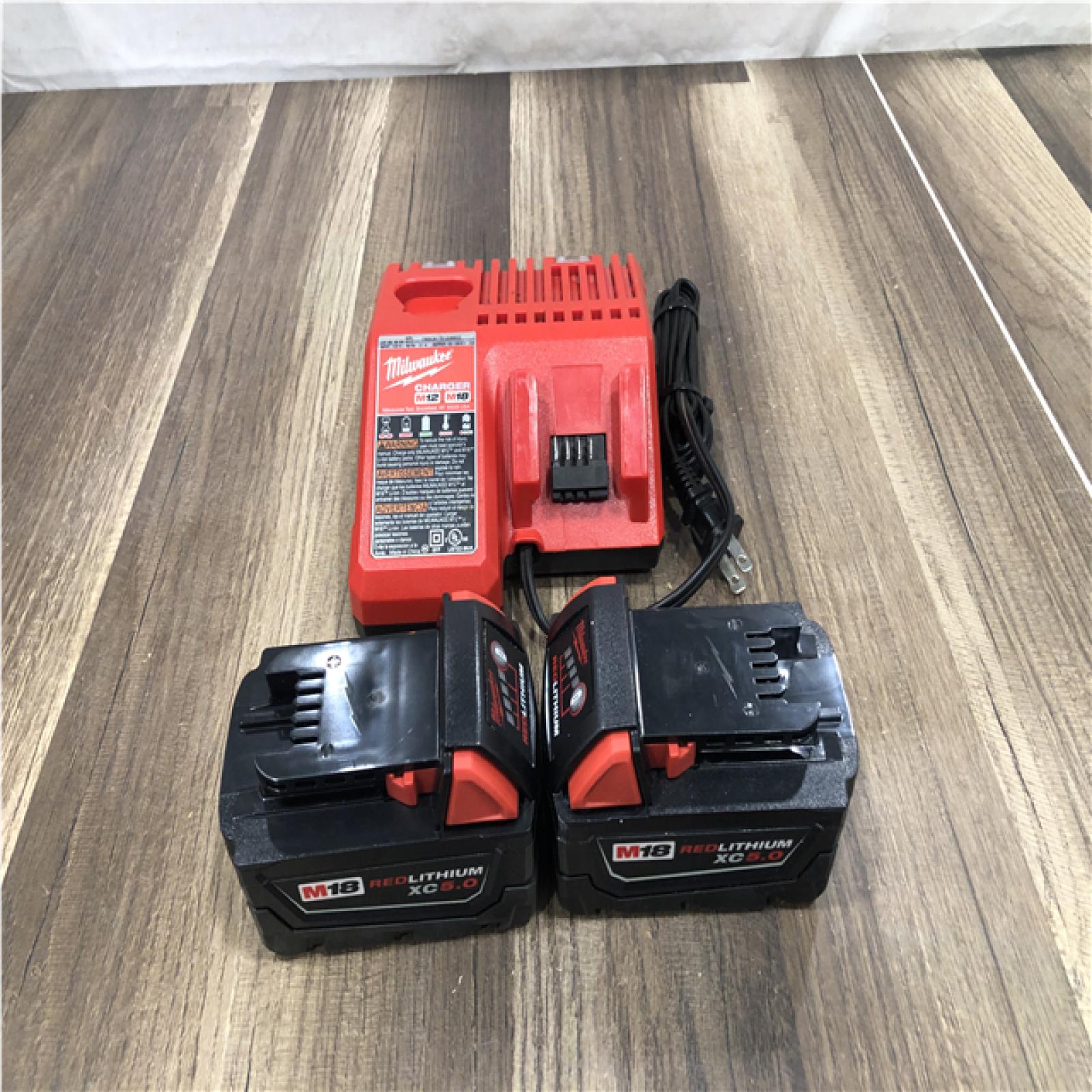 AS-IS Milwaukee 18-Volt Lithium-Ion XC Starter Kit with (2) 5.0Ah Batteries and Charger
