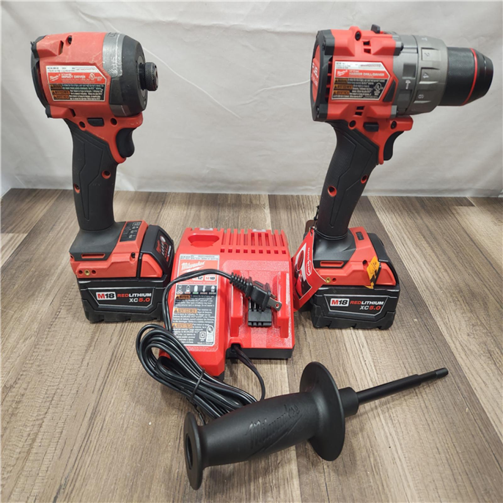 AS-IS- MILWAUKEE FUEL 18V Lithium-Ion Brushless Cordless Hammer Drill and Impact Driver Combo Kit