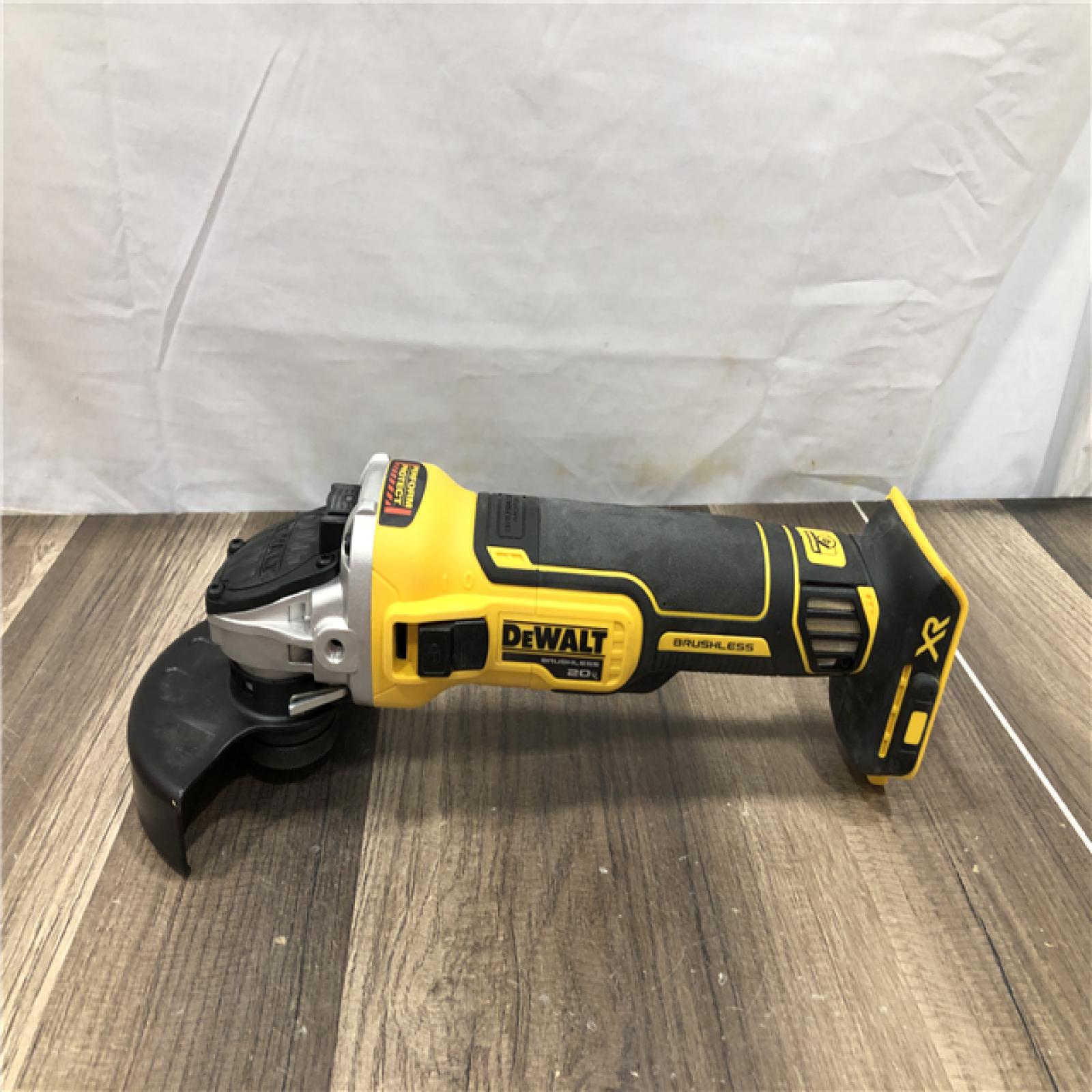 AS-IS DEWALT 20V MAX XR Cordless Brushless 4.5 in. Slide Switch Small Angle Grinder with Kickback Brake (Tool Only)