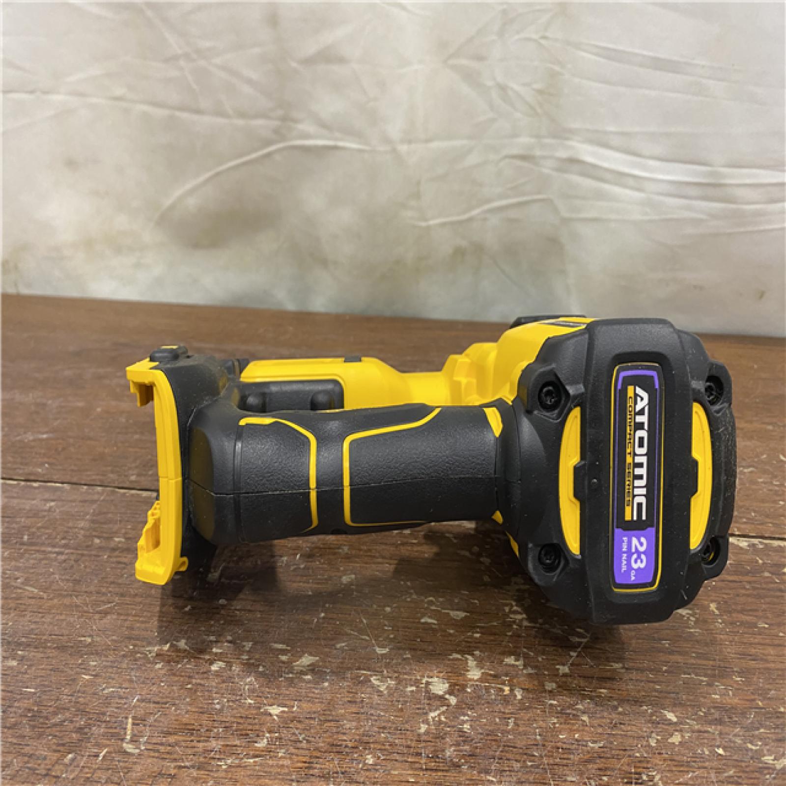 AS-IS  DEWALT ATOMIC 20V MAX Lithium Ion Cordless 23 Gauge Pin Nailer Kit with 3.0Ah Battery and Charger