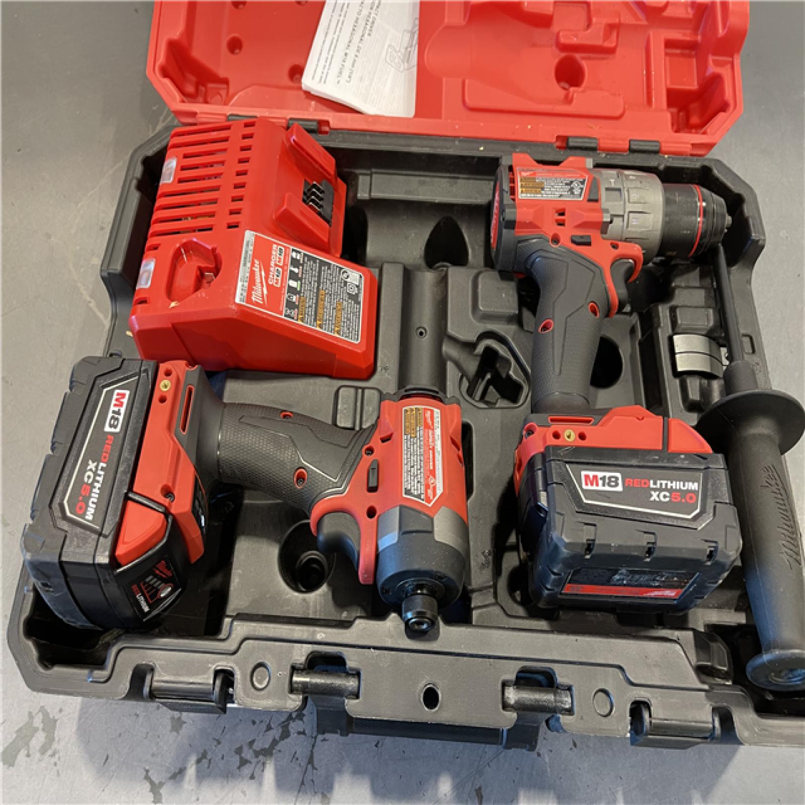AS-IS - Milwaukee M18 FUEL 18V Lithium-Ion Brushless Cordless Hammer Drill and Impact Driver Combo Kit
