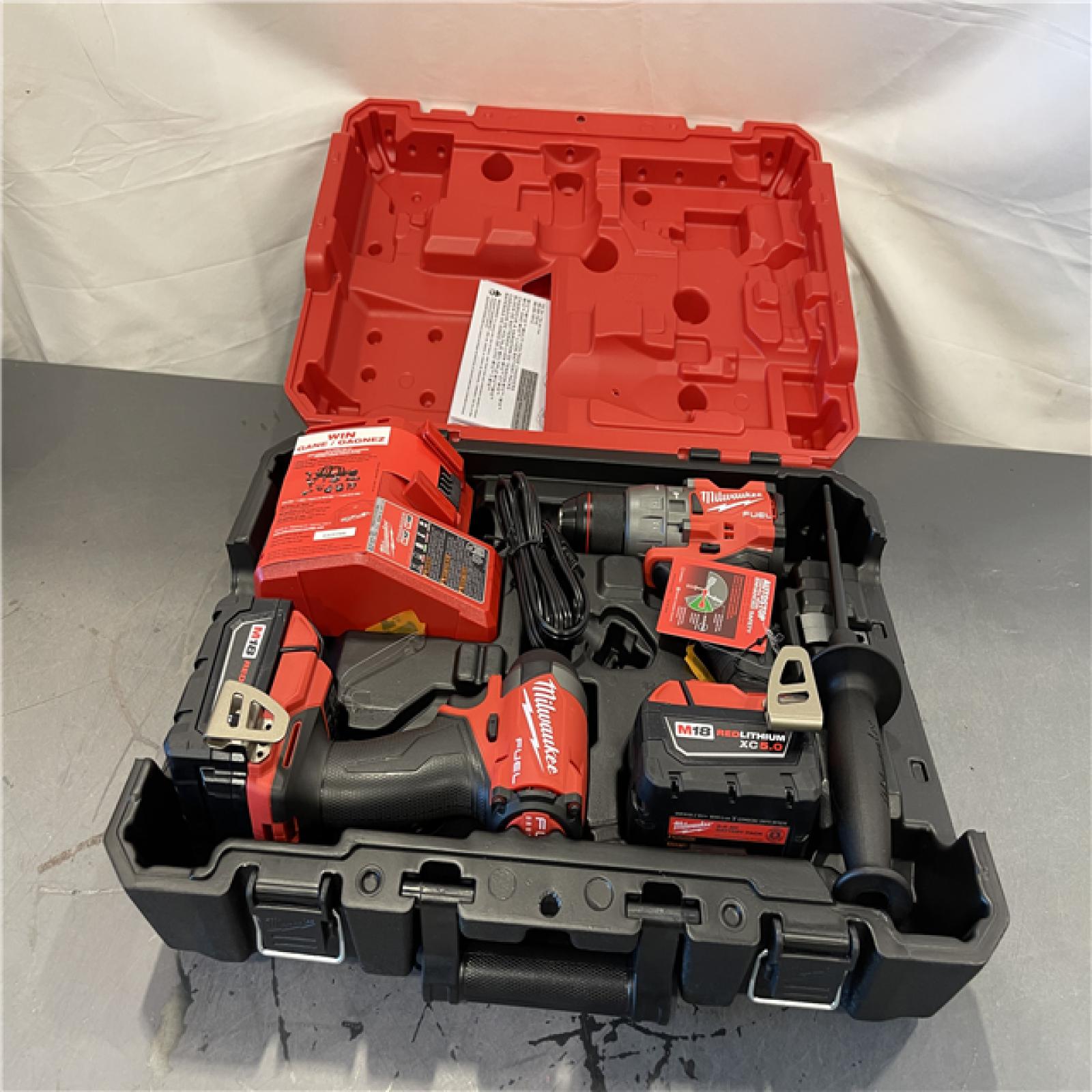 AS-IS - MILWAUKEE M18 FUEL 18V Lithium-Ion Brushless Cordless Hammer Drill and Impact Driver Combo Kit