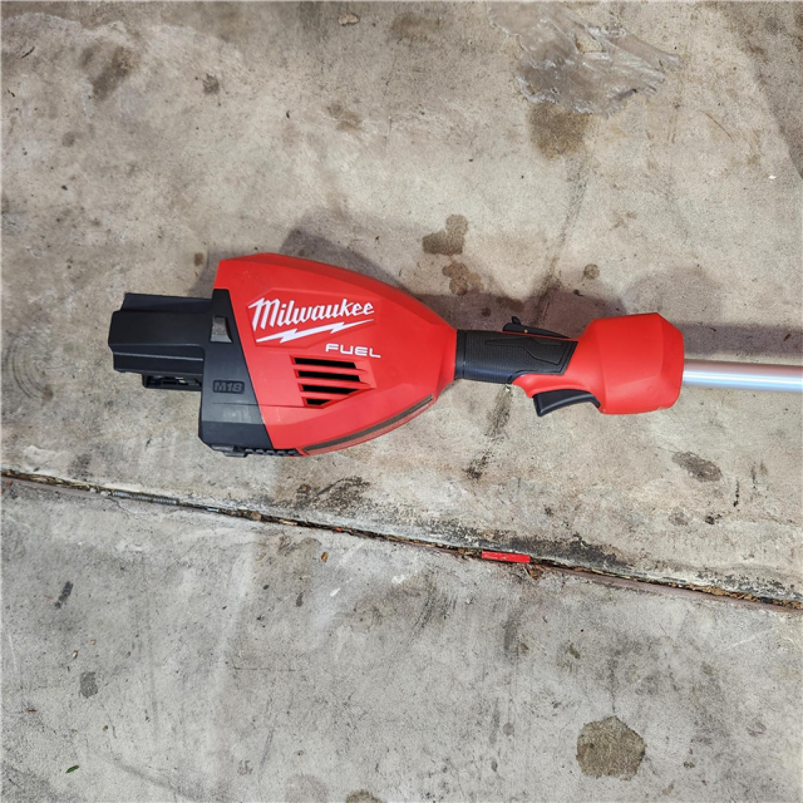 Houston location- AS-IS Milwaukee M18 FUEL 17 Dual Battery String Trimmer Appears in new condition (TOOL-ONLY)