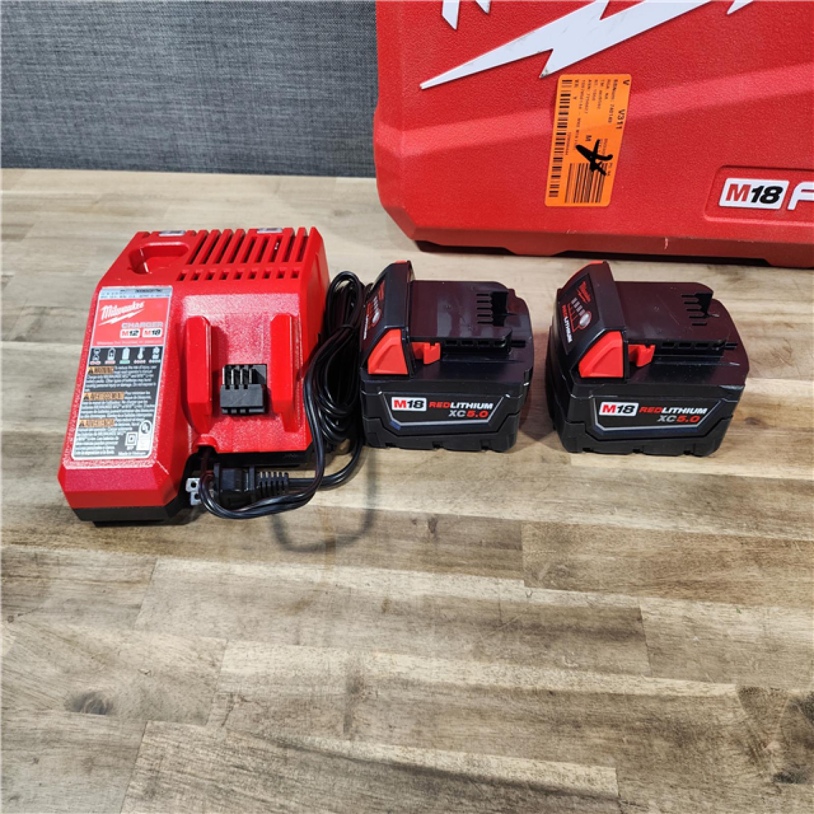 HOUSTON LOCATION - AS-IS (APPEARS LIKE NEW) MILWAUKEE M18 FUEL 18V Lithium-Ion Brushless Cordless Hammer Drill and Impact Driver Combo Kit (2-Tool) with 2 Batteries