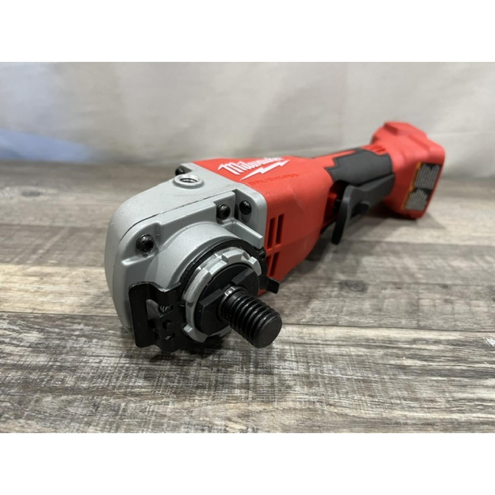 AS-IS Milwaukee 18V Lithium-Ion Brushless Cordless 4-1/2 in./5 in. Grinder w/Paddle Switch (Tool-Only)