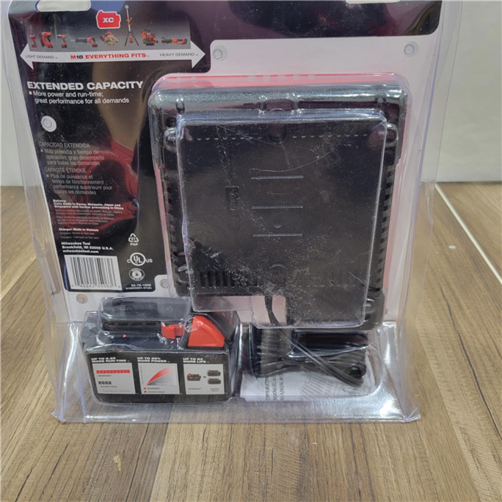 AS-IS Milwaukee M18 18-Volt Lithium-Ion XC Starter Kit with (1) 5.0Ah Battery and Charger