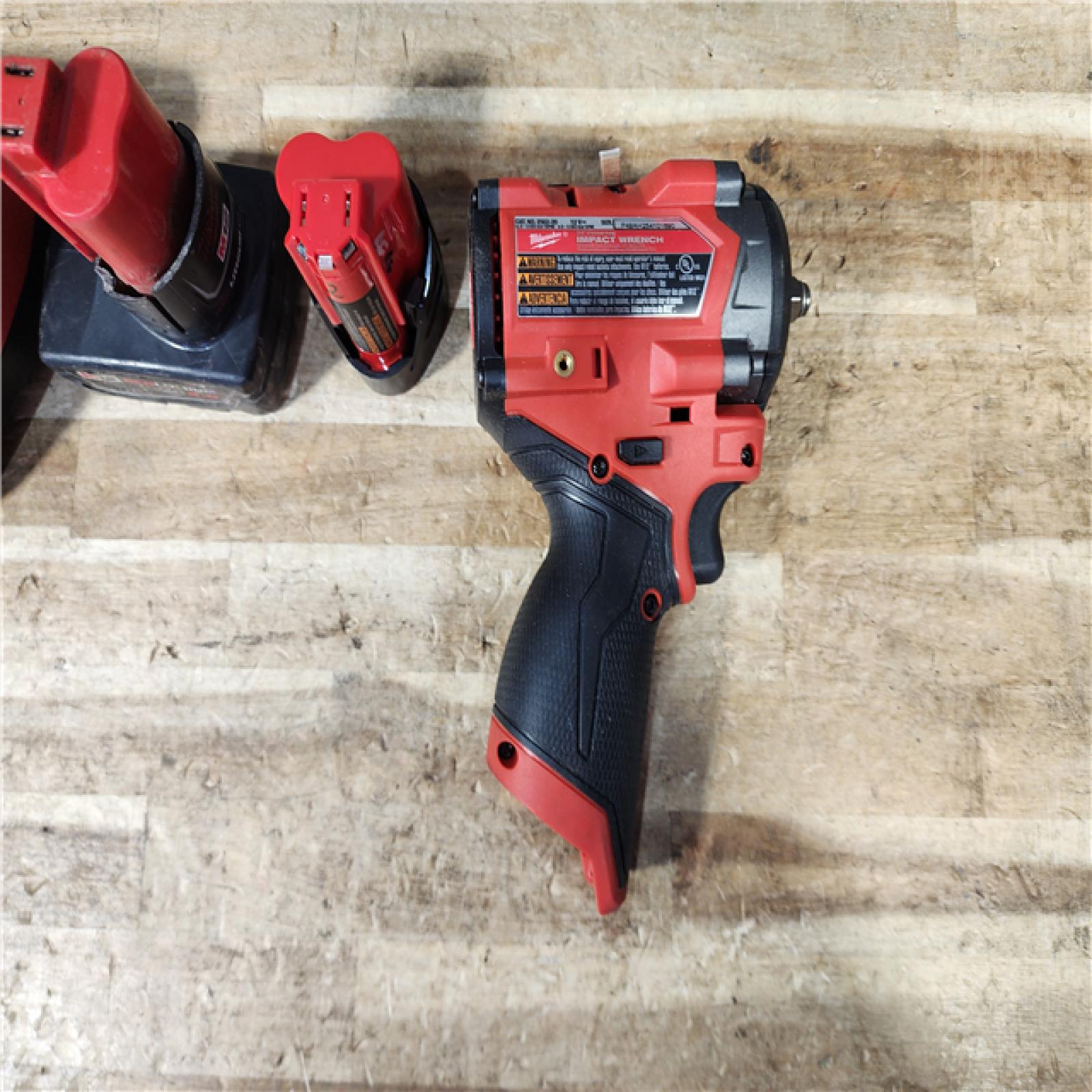 HOUSTON LOCATION - AS - IS Milwaukee FUEL 12V Li-Ion Brushless Cordless Stubby 3/8 in. Impact Wrench Kit