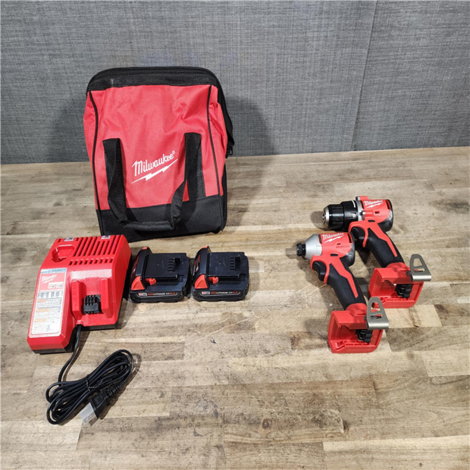 HOUSTON LOCATION - AS-IS Milwaukee M18 18V Lithium-Ion Brushless Cordless Compact Drill/Impact Combo Kit (2-Tool) W/(2) 2.0 Ah Batteries  Charger & Bag
