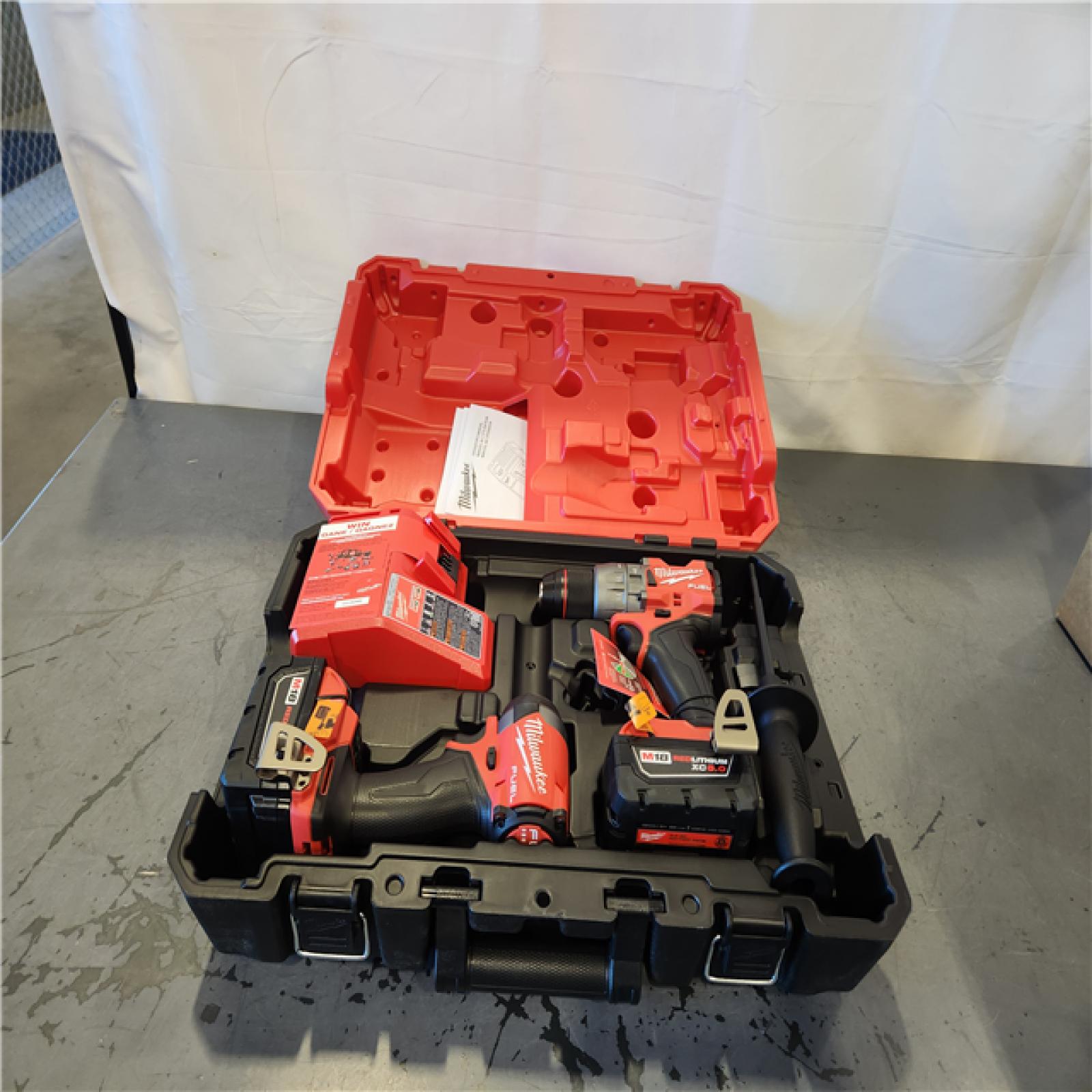 AS-IS- Milwaukee FUEL 18V Lithium-Ion Brushless Cordless Hammer Drill and Impact Driver Combo Kit