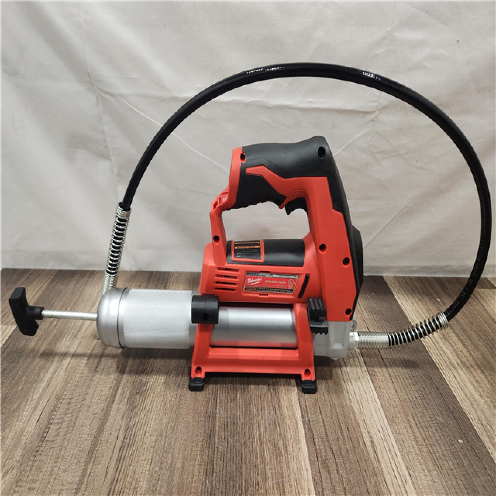 AS-IS- Milwaukee M12 Cordless LITHIUM-ION Grease Gun (Tool-Only)