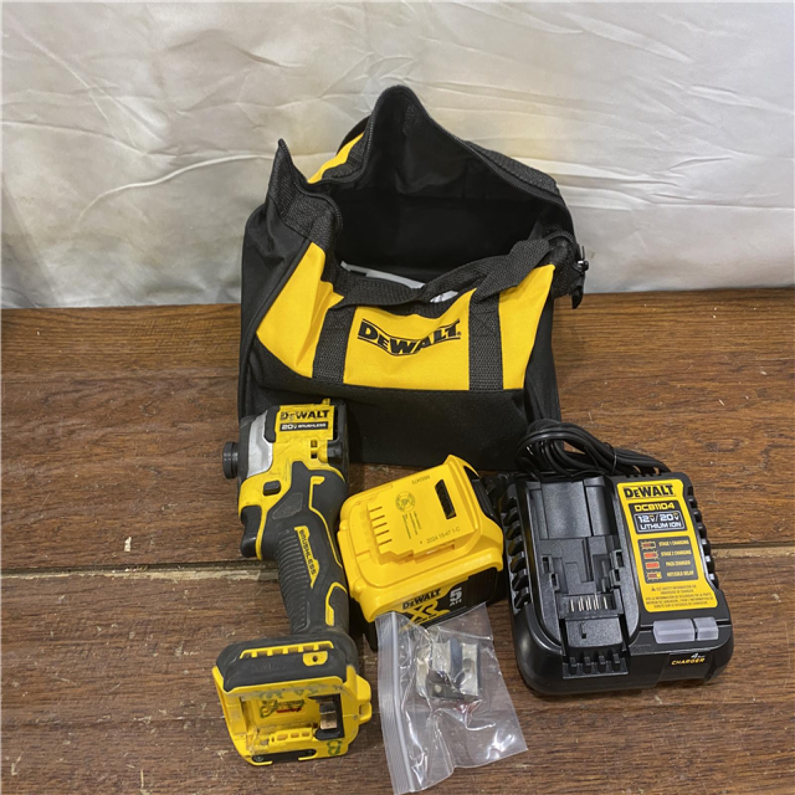 AS-IS DeWalt 20V MAX ATOMIC 1/4 in. Cordless Brushless 3-Speed Impact Driver Kit (Battery & Charger)
