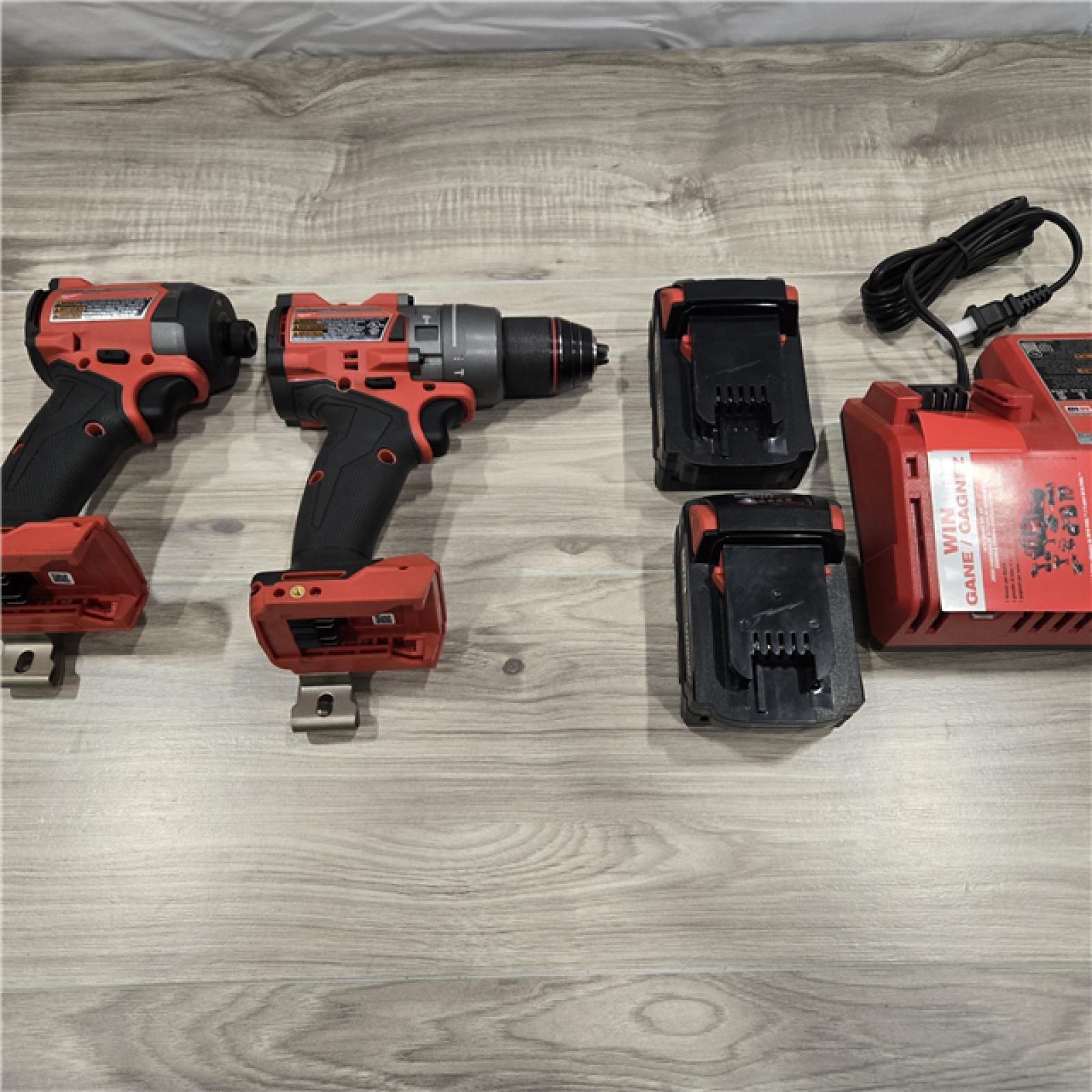AS-IS MILWAUKEE FUEL 18V Lithium-Ion Brushless Cordless Hammer Drill and Impact Driver Combo Kit (2-Tool) with 2 Batteries