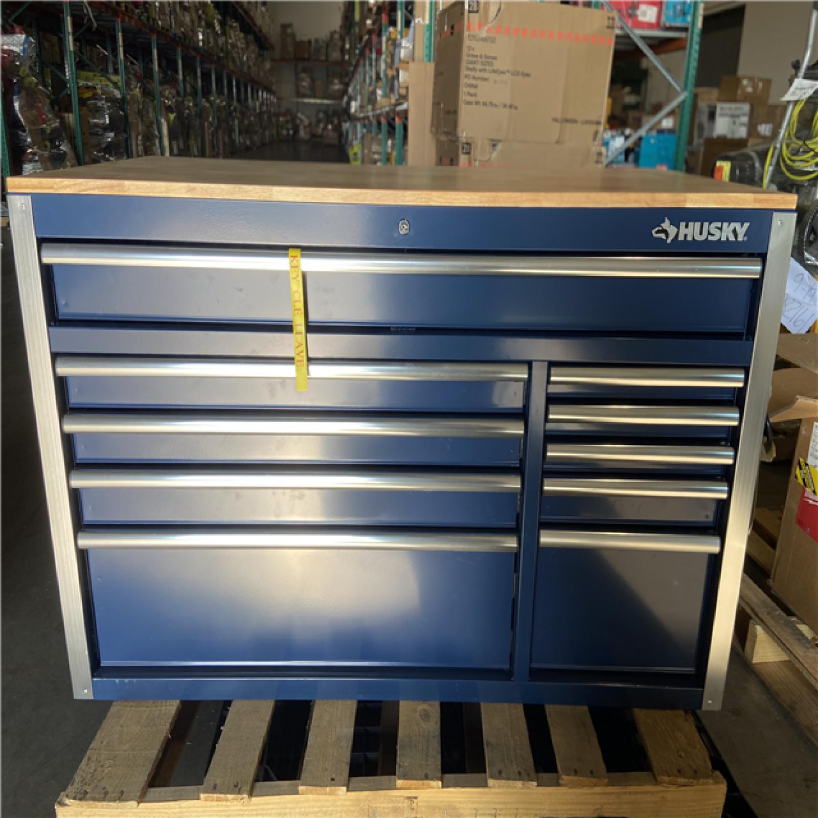 DALLAS LOCATION - Husky 52 in. W x 25 in. D 10-Drawer Mobile Workbench Tool Chest with Solid Wood Work Top in Gloss Blue