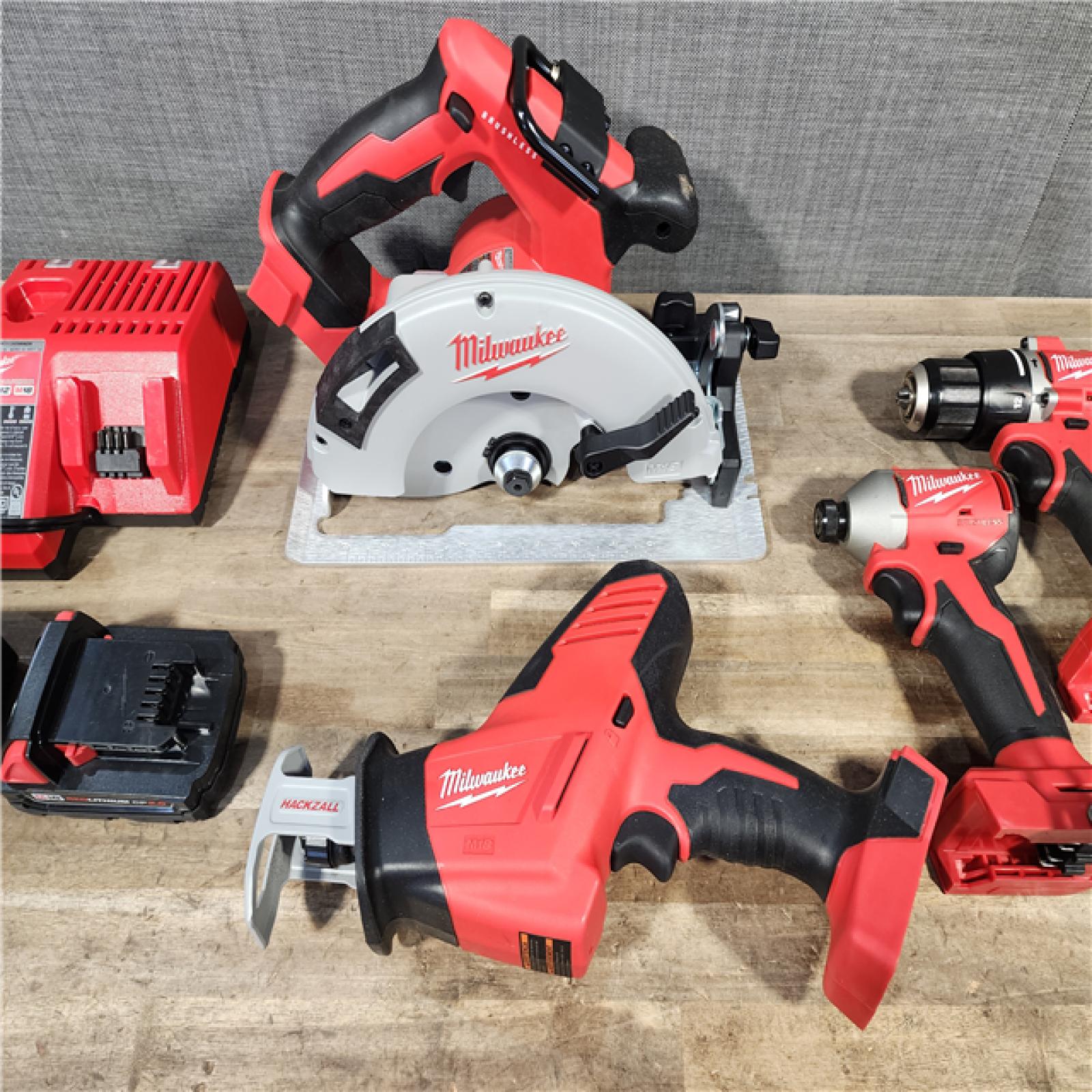 HOUSTON LOCATION - AS-IS Milwaukee M18 18-Volt Lithium-Ion Brushless Cordless Combo Kit (4-Tool) with 2-Batteries  1-Charger
