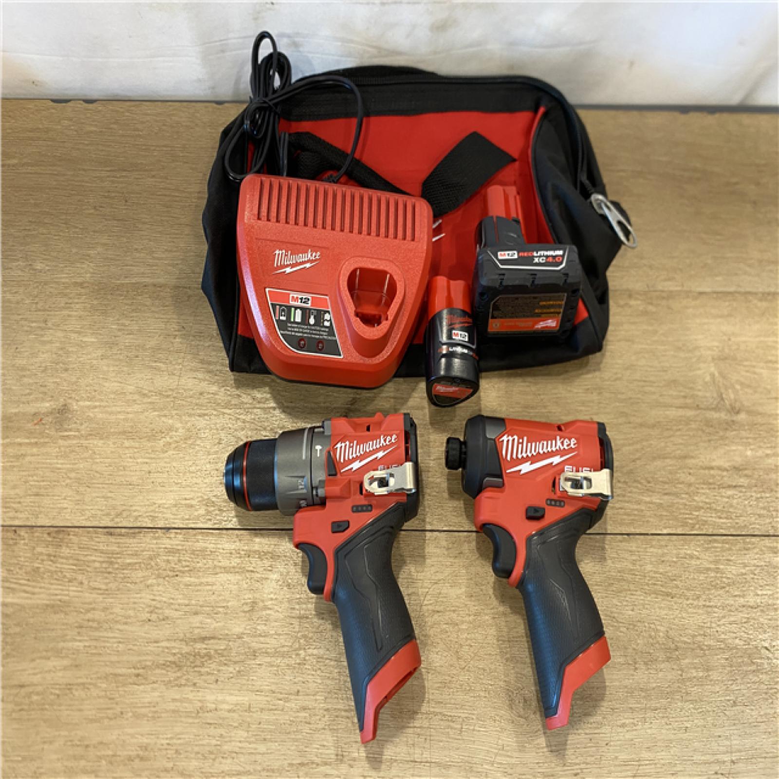 AS-IS Milwaukee FUEL 12-Volt Lithium-Ion Brushless Cordless Hammer Drill and Impact Driver Combo Kit
