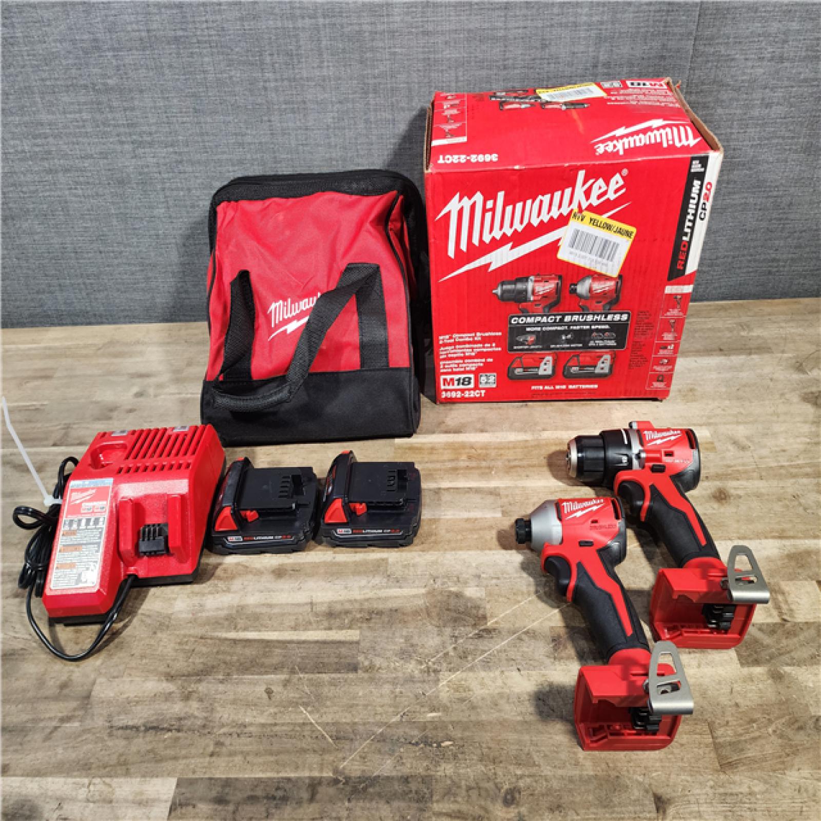 HOUSTON LOCATION - AS-IS Milwaukee M18 18V Lithium-Ion Brushless Cordless Compact Drill/Impact Combo Kit (2-Tool) W/(2) 2.0 Ah Batteries, Charger & Bag