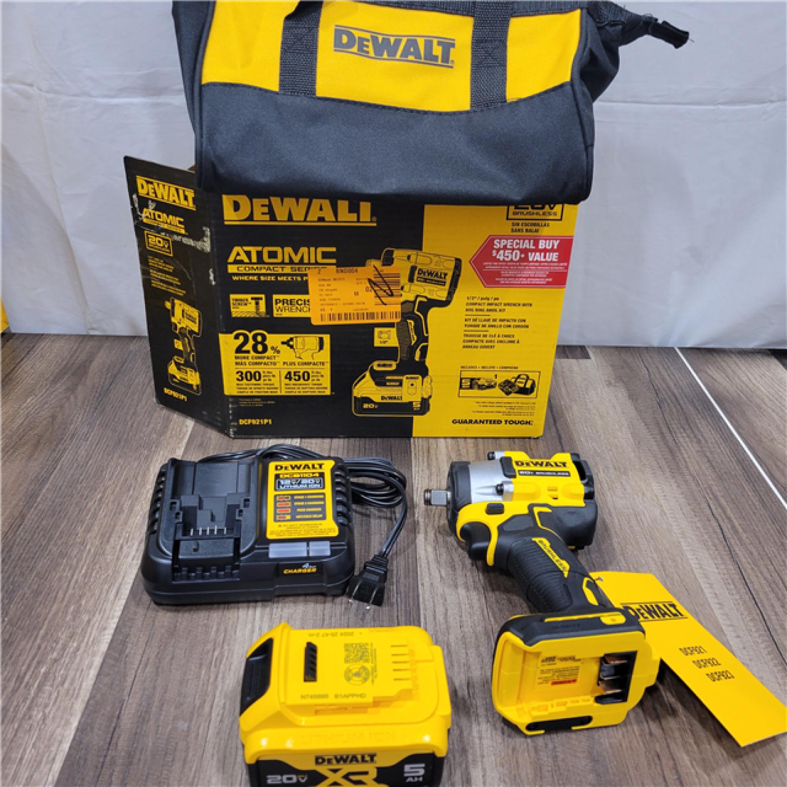 LIKE NEW! DEWALT ATOMIC 20V MAX Lithium-Ion Brushless Cordless 1/2 in. Variable Speed Impact Wrench Kit with 5 Ah Battery and Charger