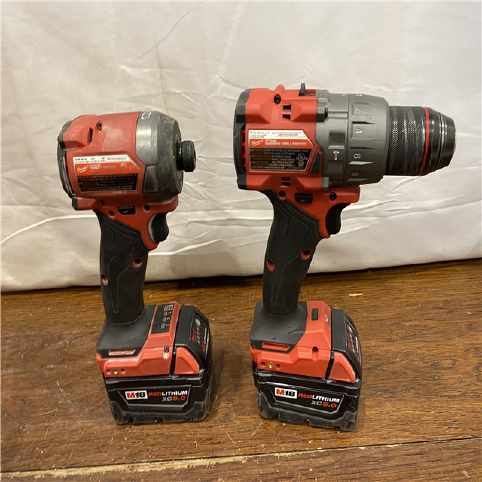 AS-IS MILWAUKEE M18 FUEL 18V Lithium-Ion Brushless Cordless Hammer Drill and Impact Driver Combo Kit (2-Tool) with 2 Batteries