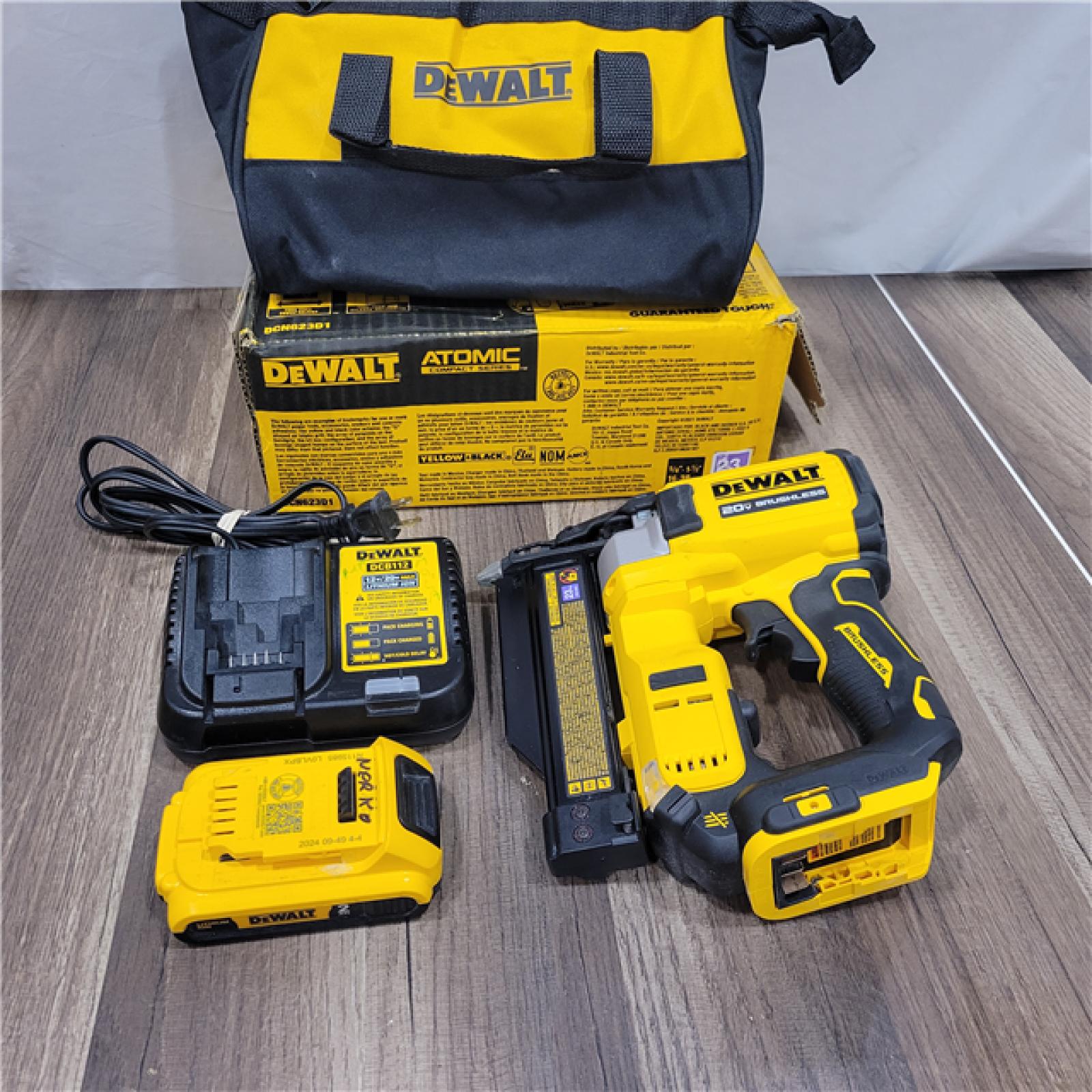 AS-IS DEWALT ATOMIC 20V MAX Lithium Ion Cordless 23 Gauge Pin Nailer Kit with 3.0Ah Battery and Charger