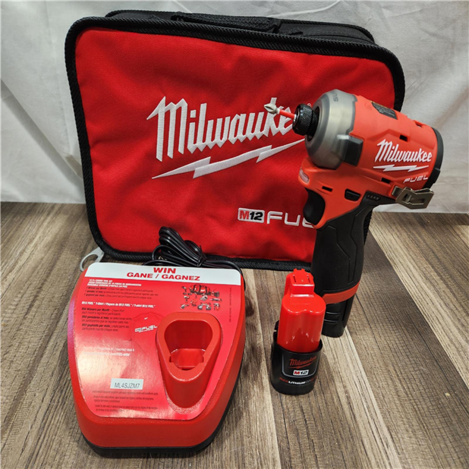 AS-IS- Milwaukee M12 FUEL SURGE 12V Lithium-Ion Brushless Cordless 1/4 in. Hex Impact Driver Compact Kit W/Two 2.0Ah Batteries  Bag