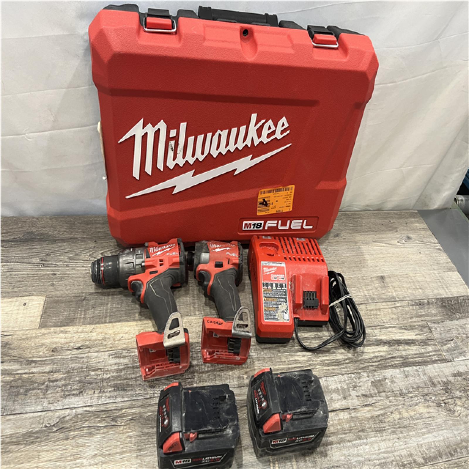 AS-IS Milwaukee FUEL 18V Lithium-Ion Brushless Cordless Hammer Drill and Impact Driver Combo Kit