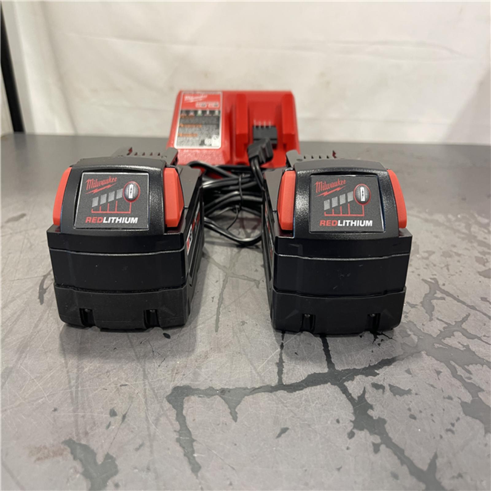 AS-IS- Milwaukee M18 18-Volt Lithium-Ion XC Starter Kit with Two 5.0Ah Batteries and Charger