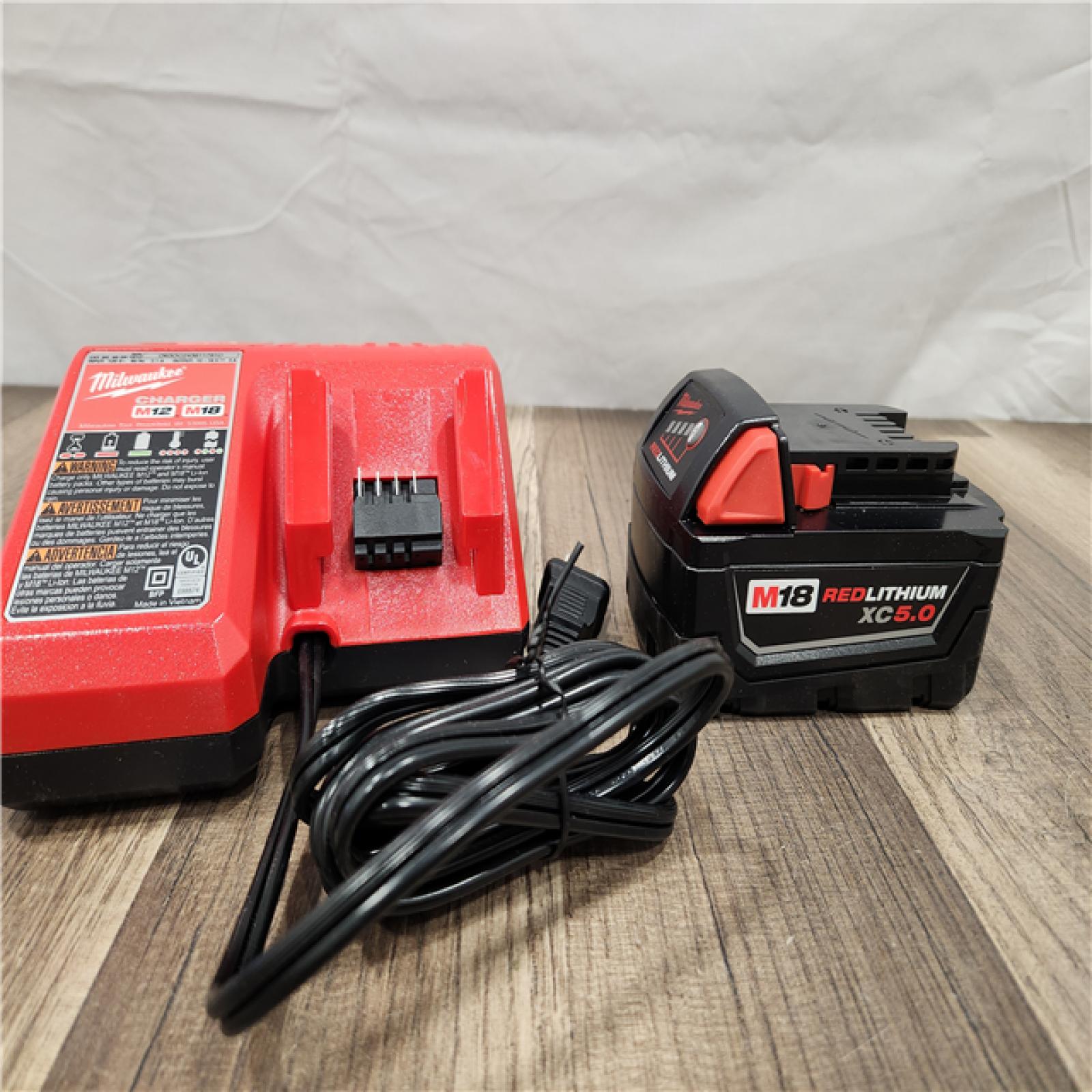 AS-IS - Milwaukee M18 18-Volt Lithium-Ion XC Starter Kit with One 5.0Ah Battery and Charger