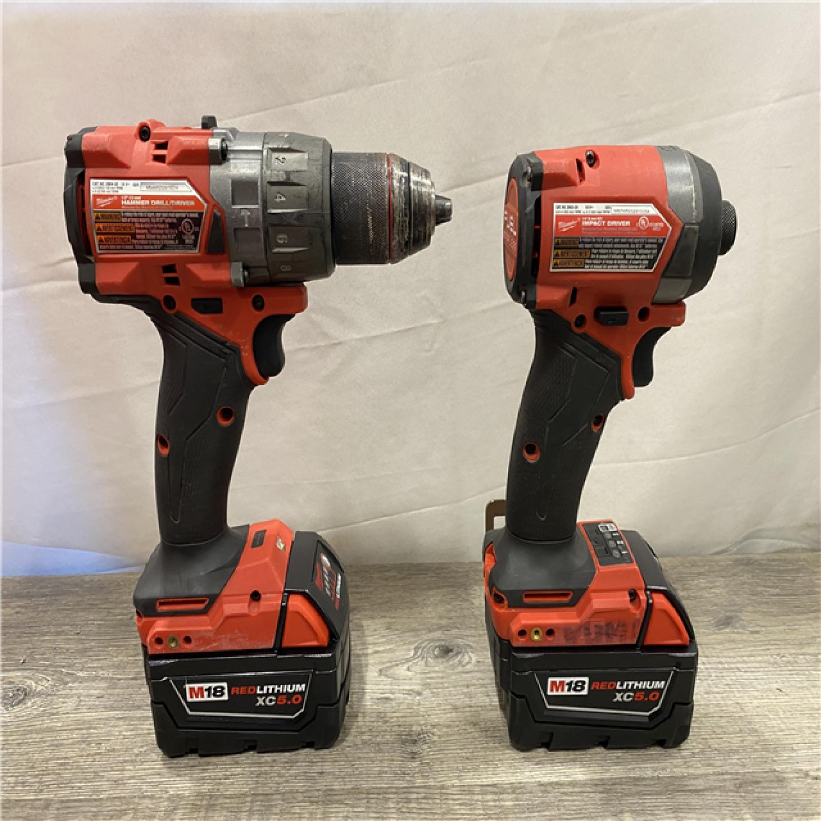 AS-IS Milwaukee FUEL 18V Lithium-Ion Brushless Cordless Hammer Drill and Impact Driver Combo Kit