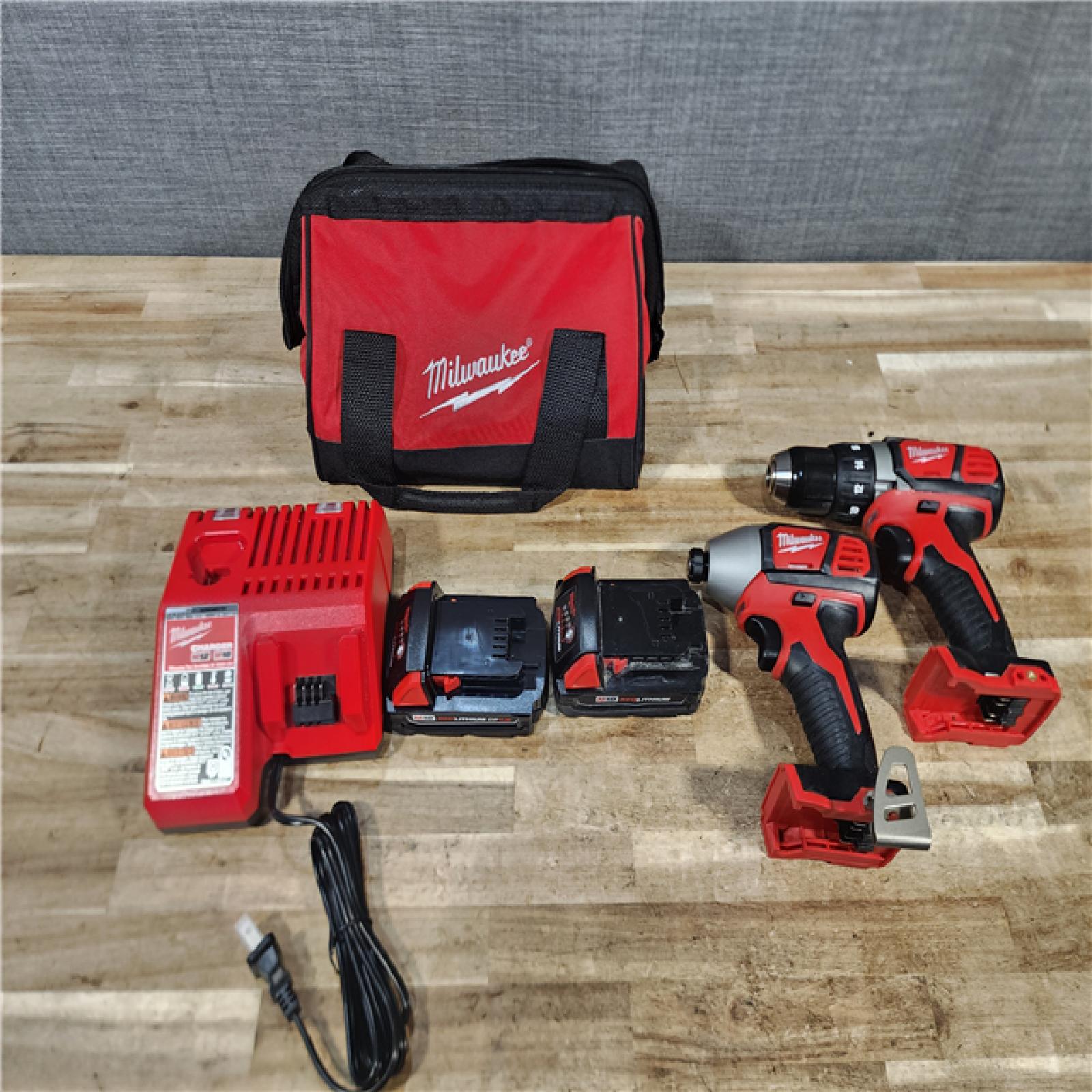 HOUSTON LOCATION - AS - IS Milwaukee 18V Lithium-Ion Cordless Drill Driver/Impact Driver Combo Kit