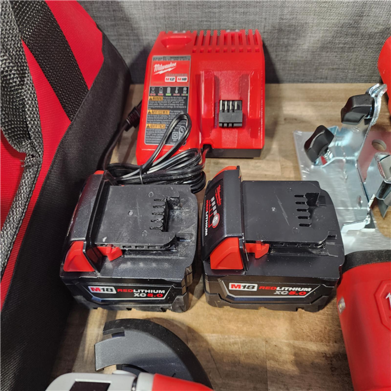 HOUSTON LOCATION - AS-IS Milwaukee M18 18-Volt Lithium-Ion Cordless Combo Kit (9-Tool) with (2) Batteries  Charger  and Tool Bag