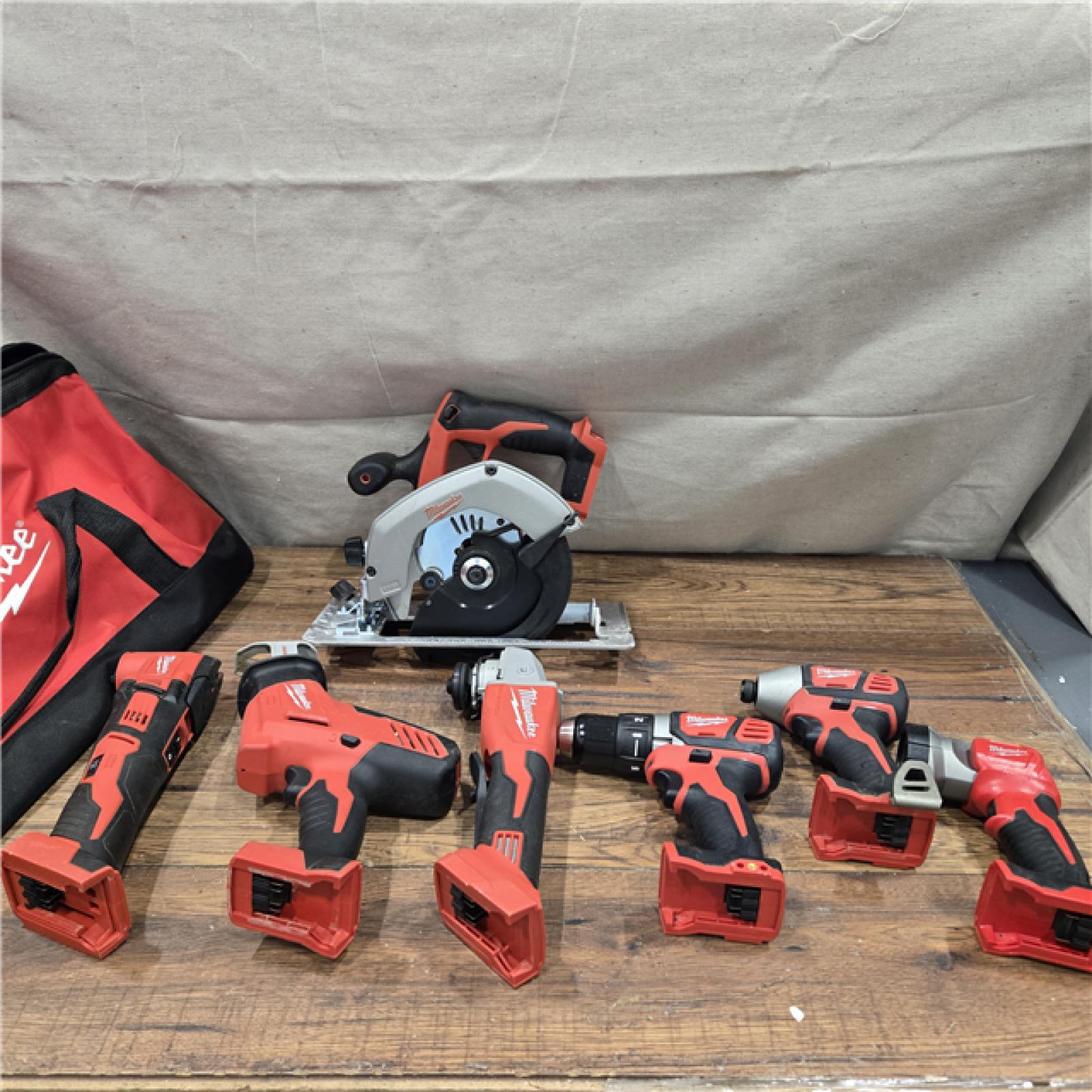 AS-IS Milwaukee M18 18-Volt Lithium-Ion Cordless Combo Kit 7-Tool with 2-Batteries, Charger and Tool Bag