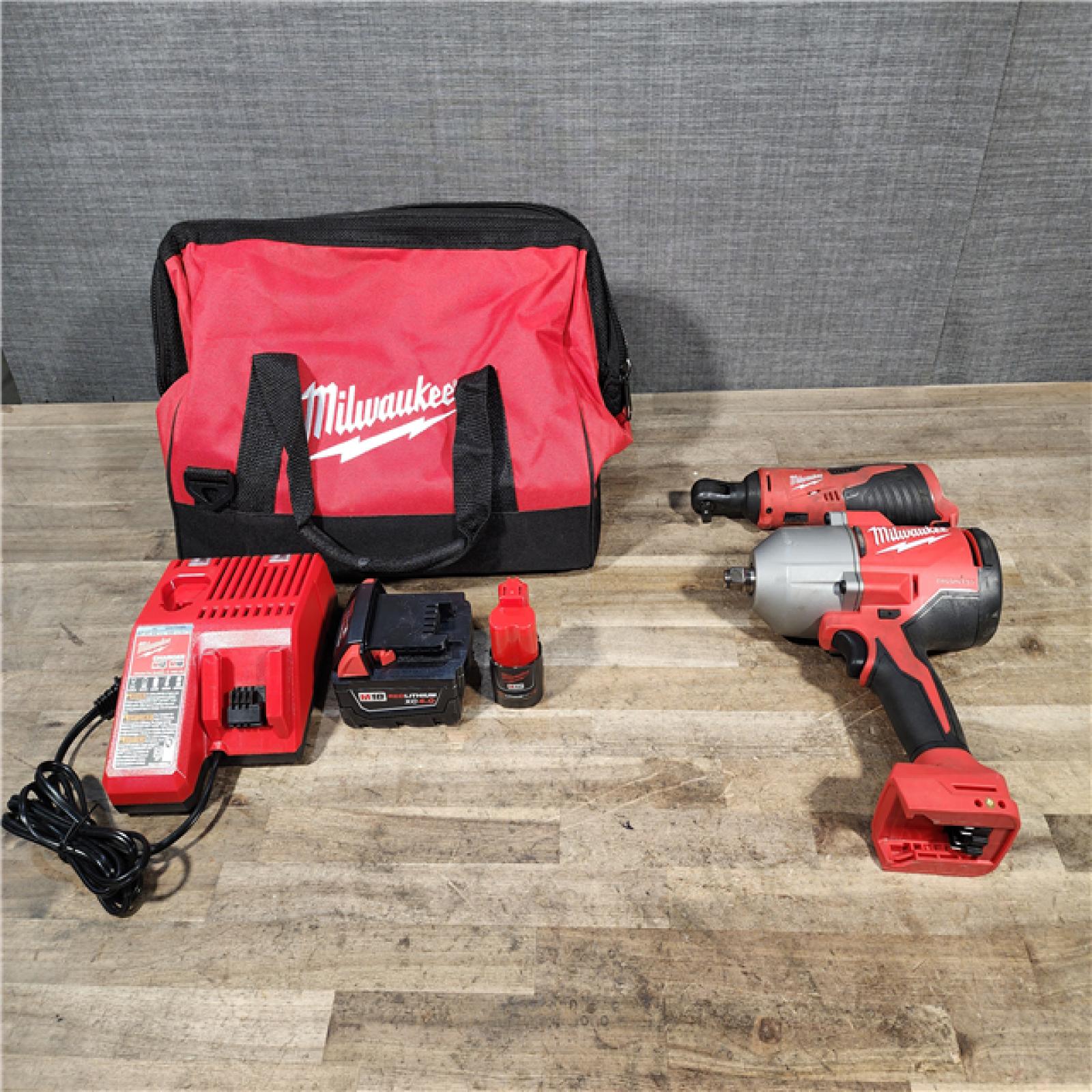 HOUSTON LOCATION - AS-IS Milwaukee 12/18V Lithium-Ion Cordless 3/8 in. Ratchet and 1/2 in. High Torque Impact Wrench with Friction Ring Combo Kit