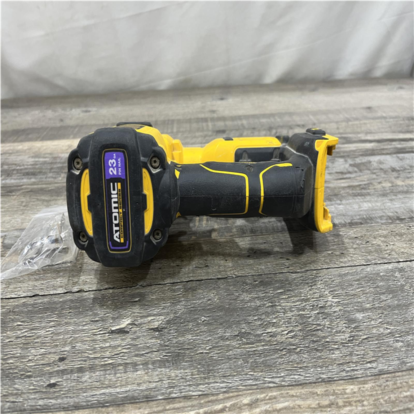 AS-IS DEWALT ATOMIC 20V MAX Lithium Ion Cordless 23 Gauge Pin Nailer (Tool Only)