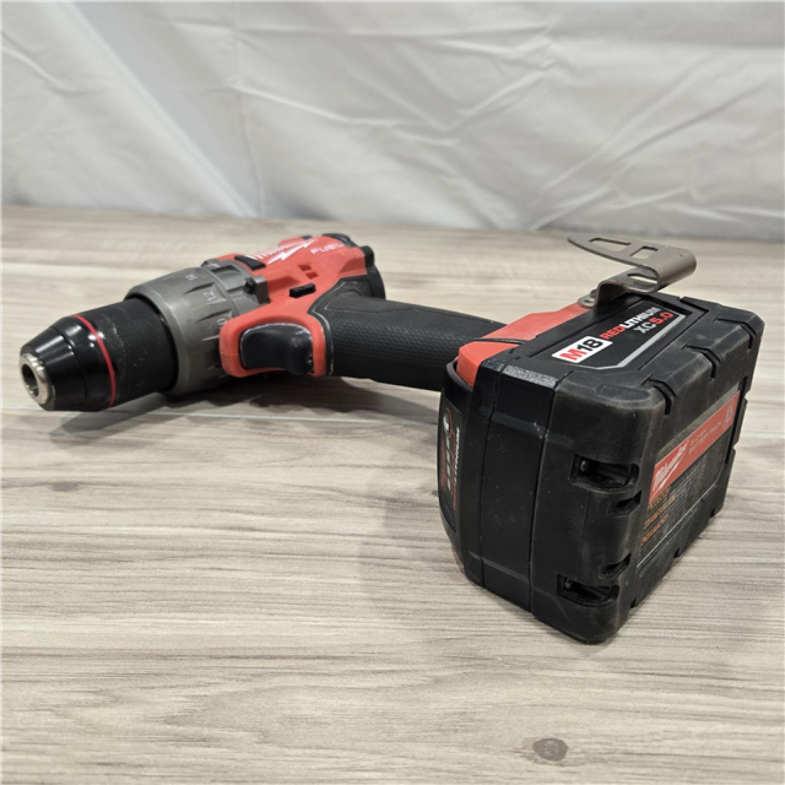 AS-IS MILWAUKEE FUEL 18V Lithium-Ion Brushless Cordless Hammer Drill and Impact Driver Combo Kit (2-Tool) with 2 Batteries