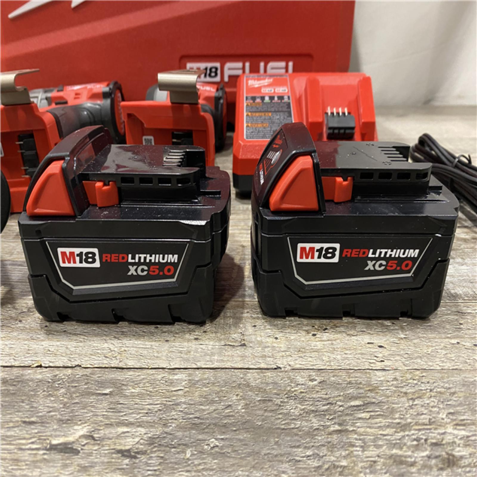 AS-IS Milwaukee FUEL 18V Lithium-Ion Brushless Cordless Hammer Drill and Impact Driver Combo Kit