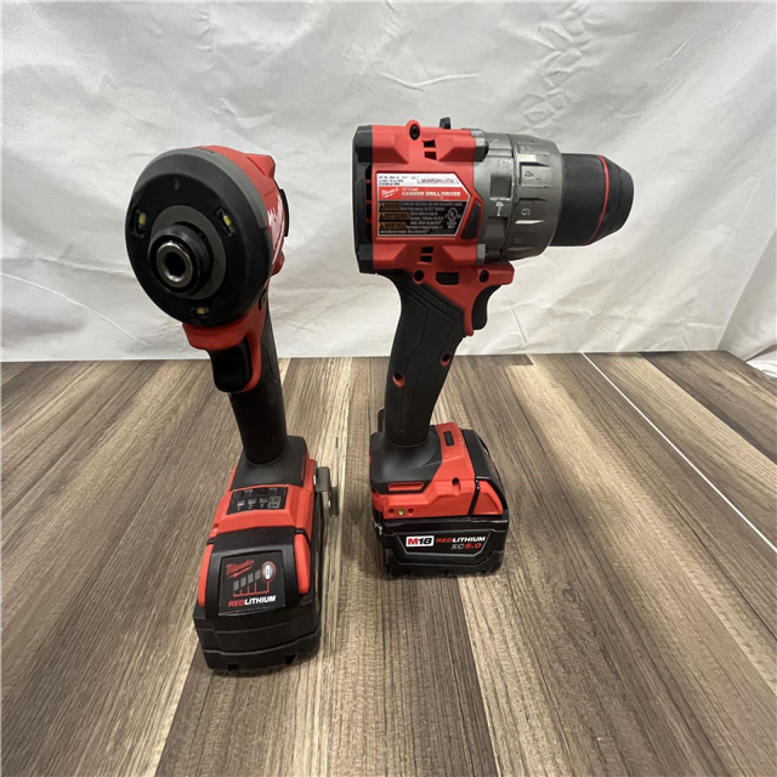 AS-IS MILWAUKEE FUEL 18V Lithium-Ion Brushless Cordless Hammer Drill and Impact Driver Combo Kit (2-Tool) with 2 Batteries