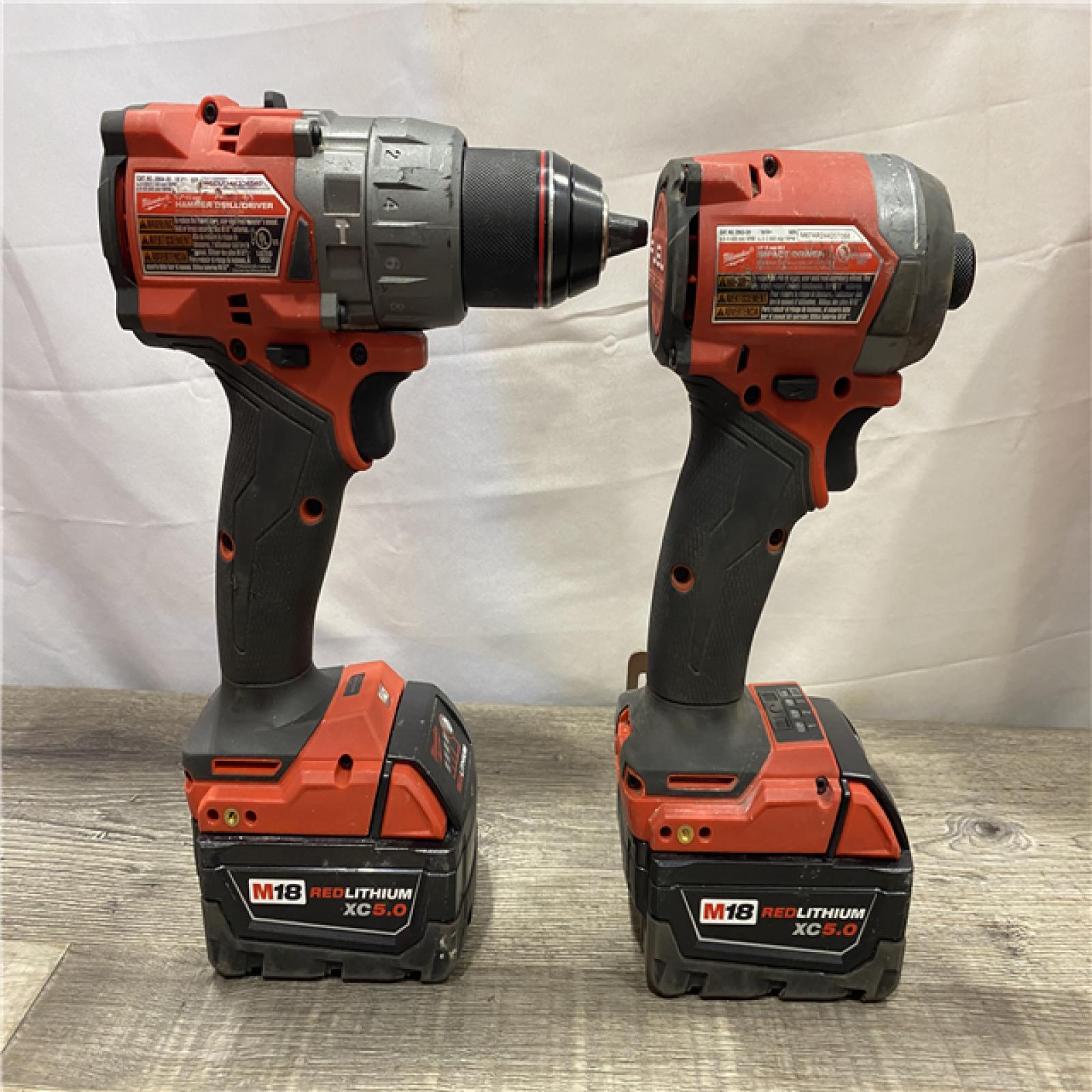 AS-IS Milwaukee FUEL 18V Lithium-Ion Brushless Cordless Hammer Drill and Impact Driver Combo Kit