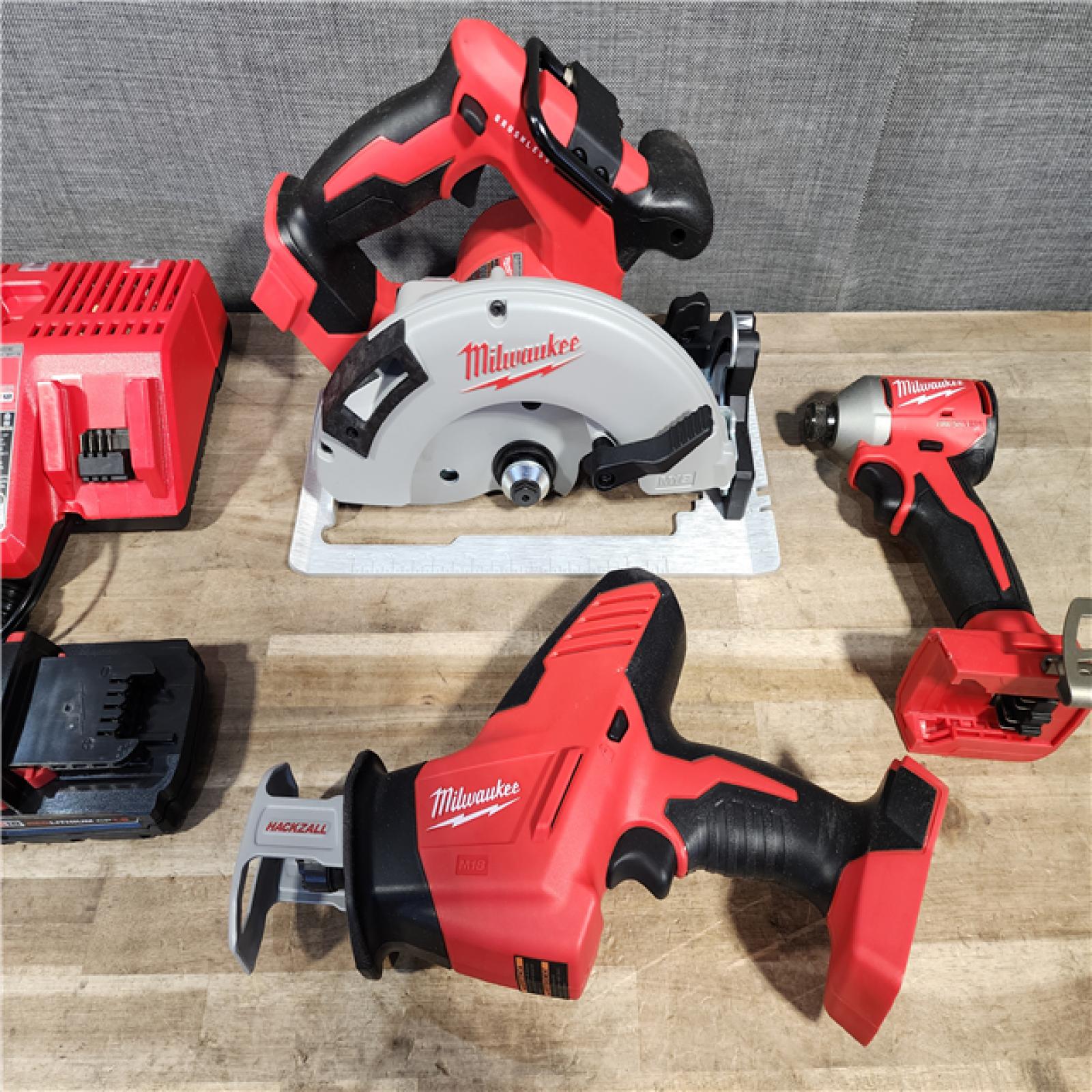 HOUSTON LOCATION - AS-IS Milwaukee M18 18-Volt Lithium-Ion Brushless Cordless Combo Kit (3-Tool) with 2-Batteries, 1-Charger and Tool Bag
