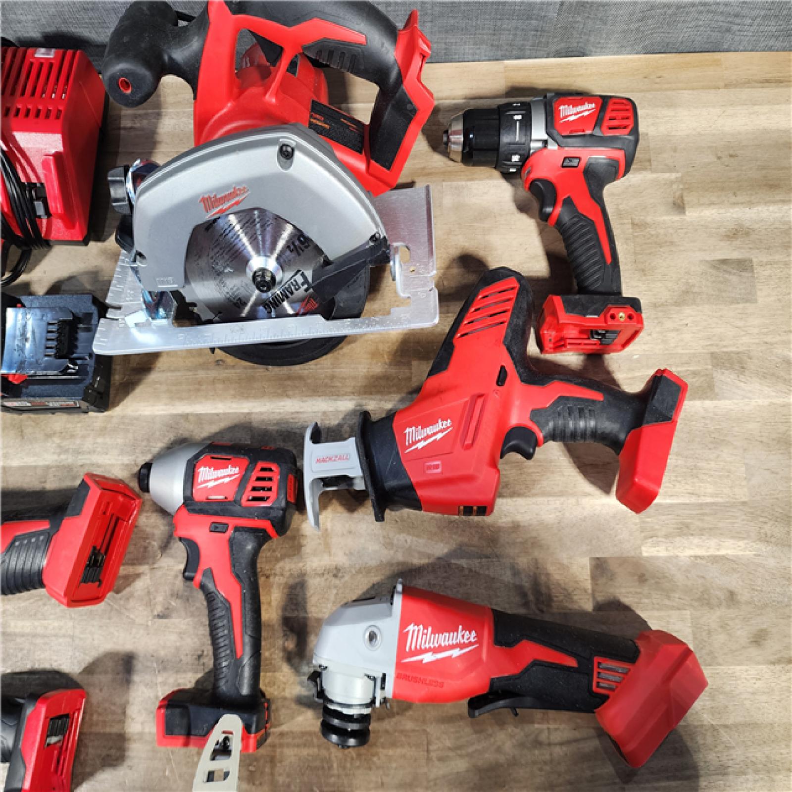 HOUSTON LOCATION - AS-IS Milwaukee M18 18-Volt Lithium-Ion Cordless Combo Kit 7-Tool with 2-Batteries, Charger and Tool Bag