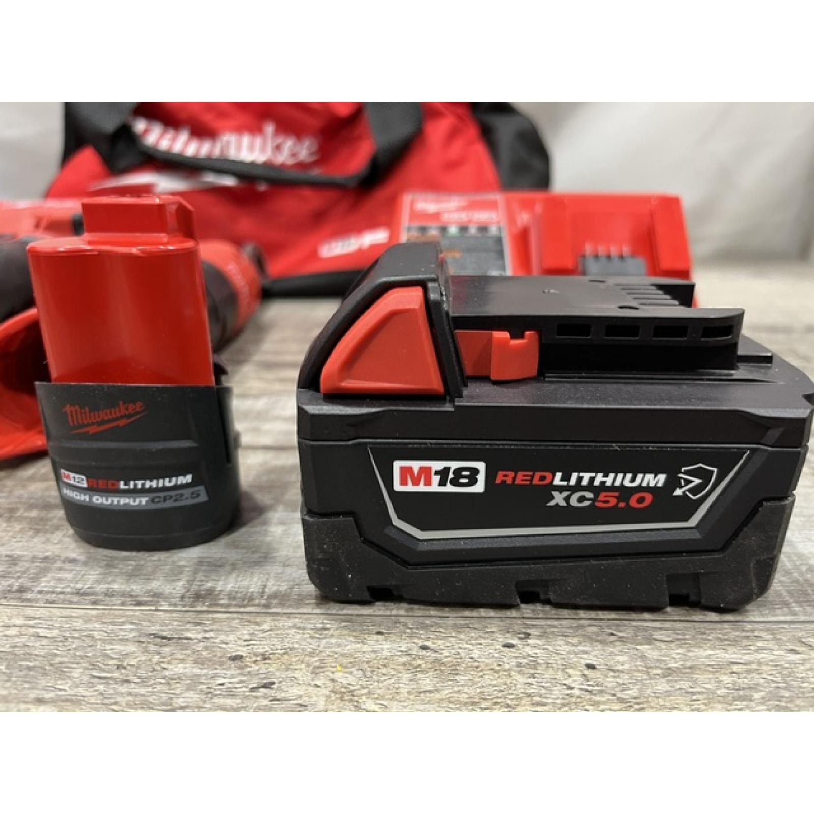 AS-IS Milwaukee FUEL 18V Cordless Mid Torque 1/2 in. Impact Wrench w/ 12 FUEL 3/8 in. Ratchet Combo Kit