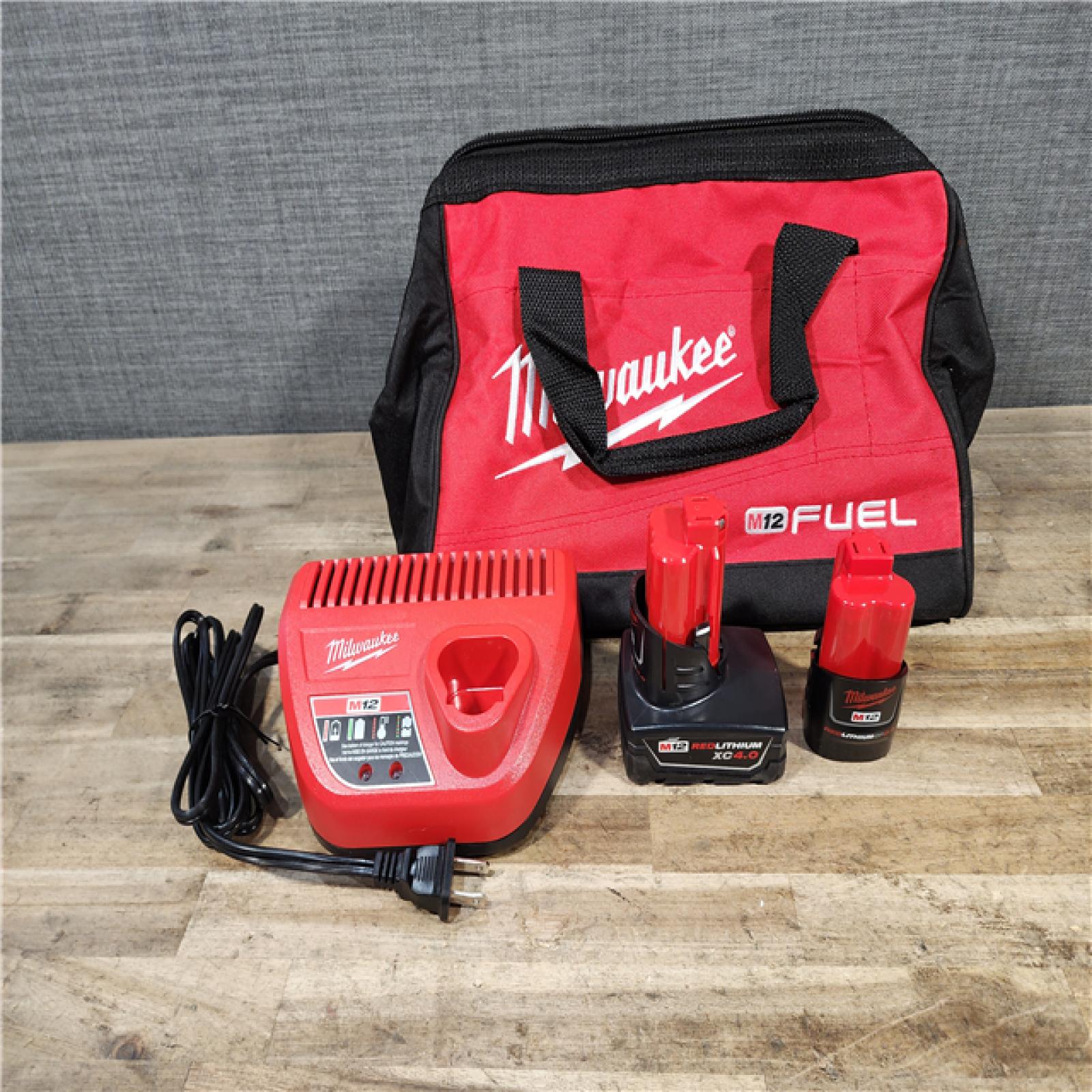 HOUSTON LOCATION - AS-IS Milwaukee FUEL 12-Volt Lithium-Ion Brushless Cordless Hammer Drill and Impact Driver Combo Kit